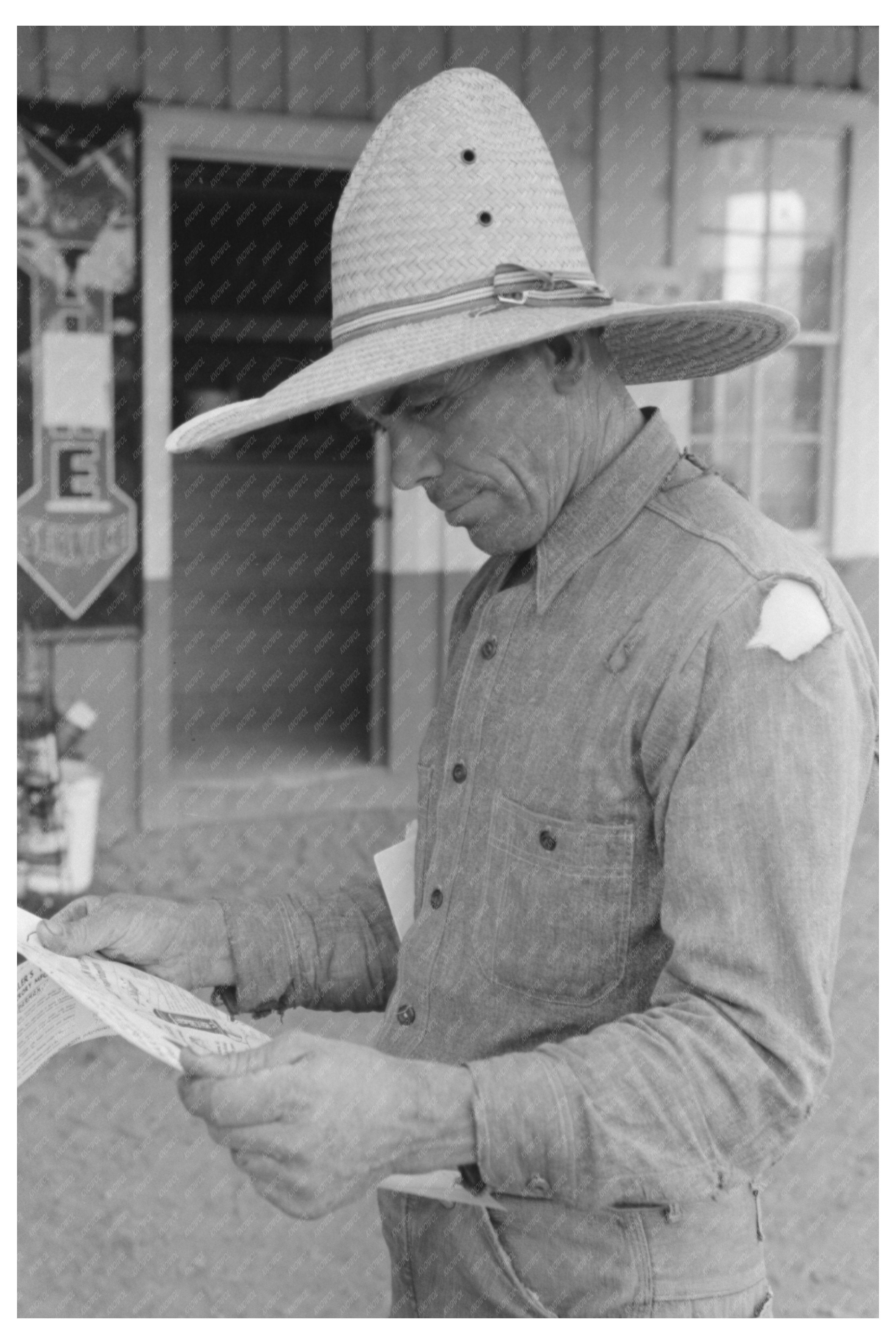 Mr. Leatherman Reading about Electric Fencing in Pie Town 1940