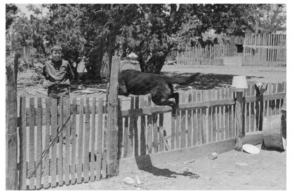 Young Hutton Feeding Chickens in Pie Town New Mexico 1940