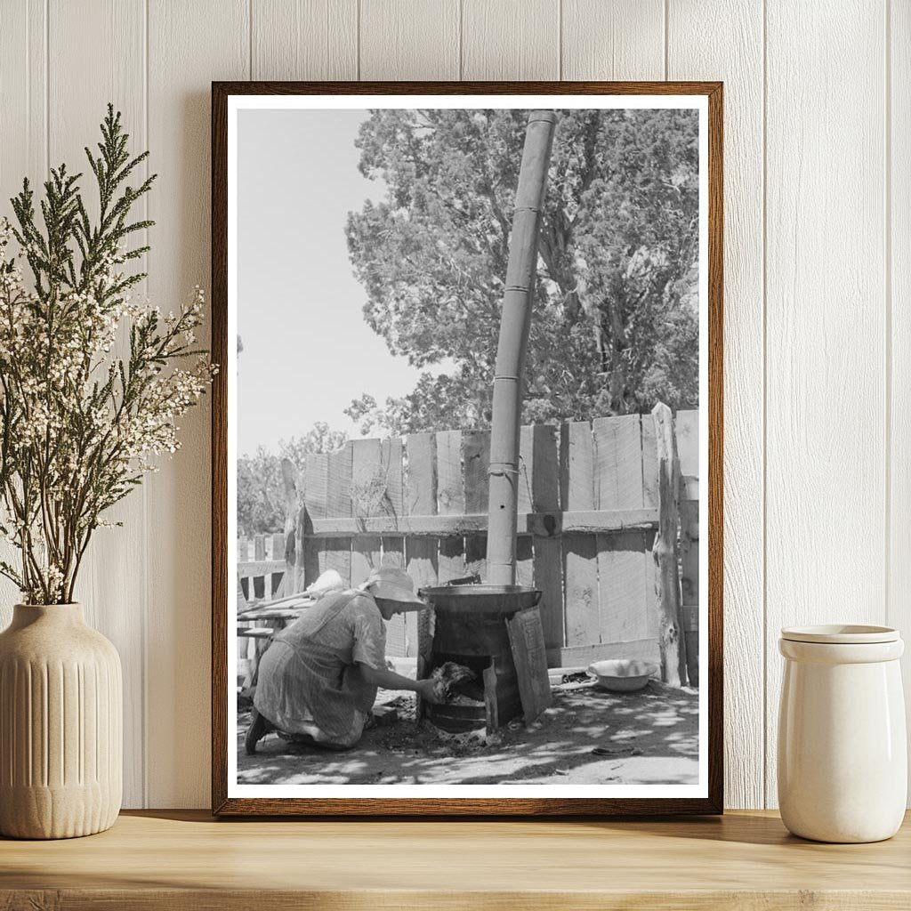 Mrs. Hutton Heats Water in Pie Town New Mexico June 1940