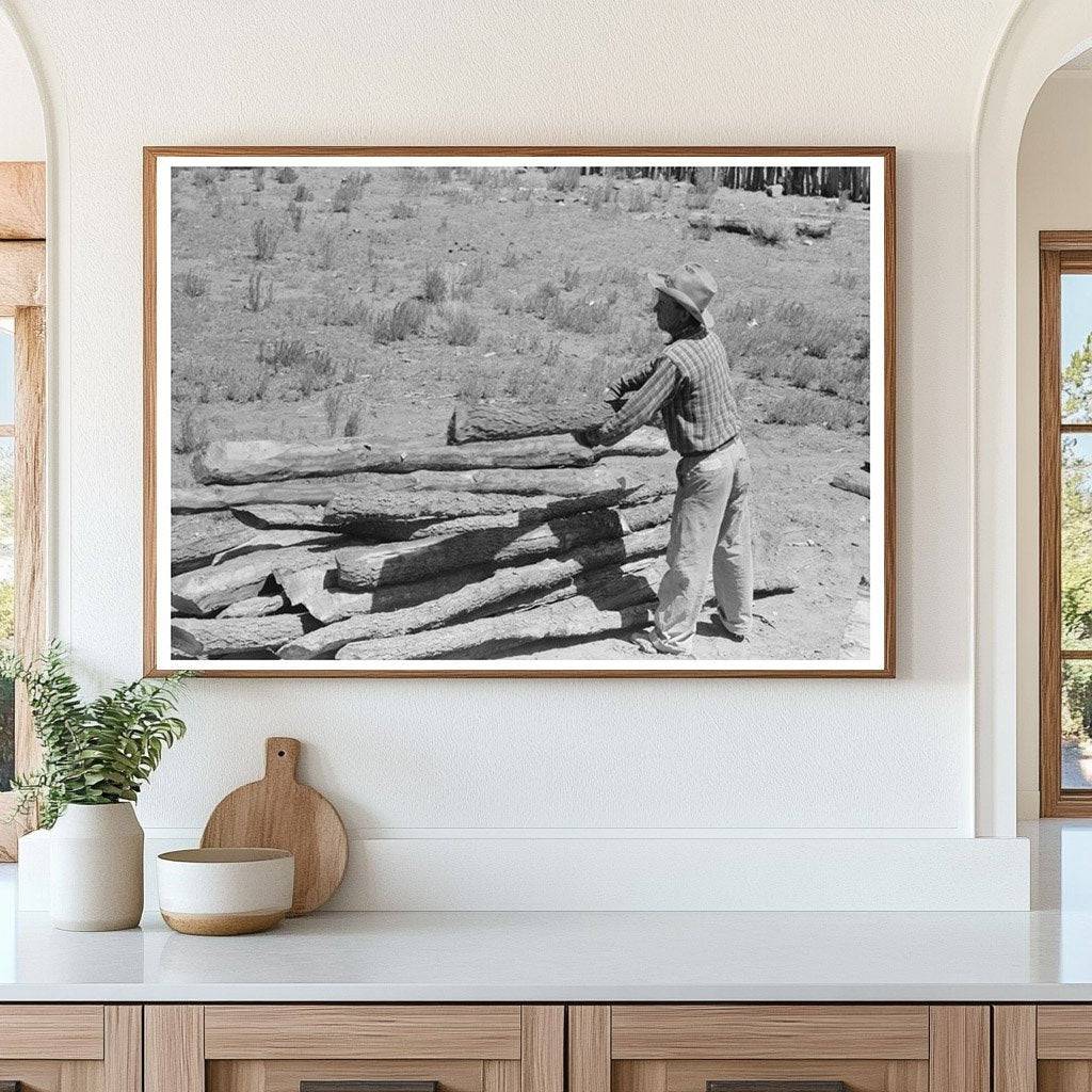 John Adams Stacks Pinon Poles in Pie Town New Mexico 1940