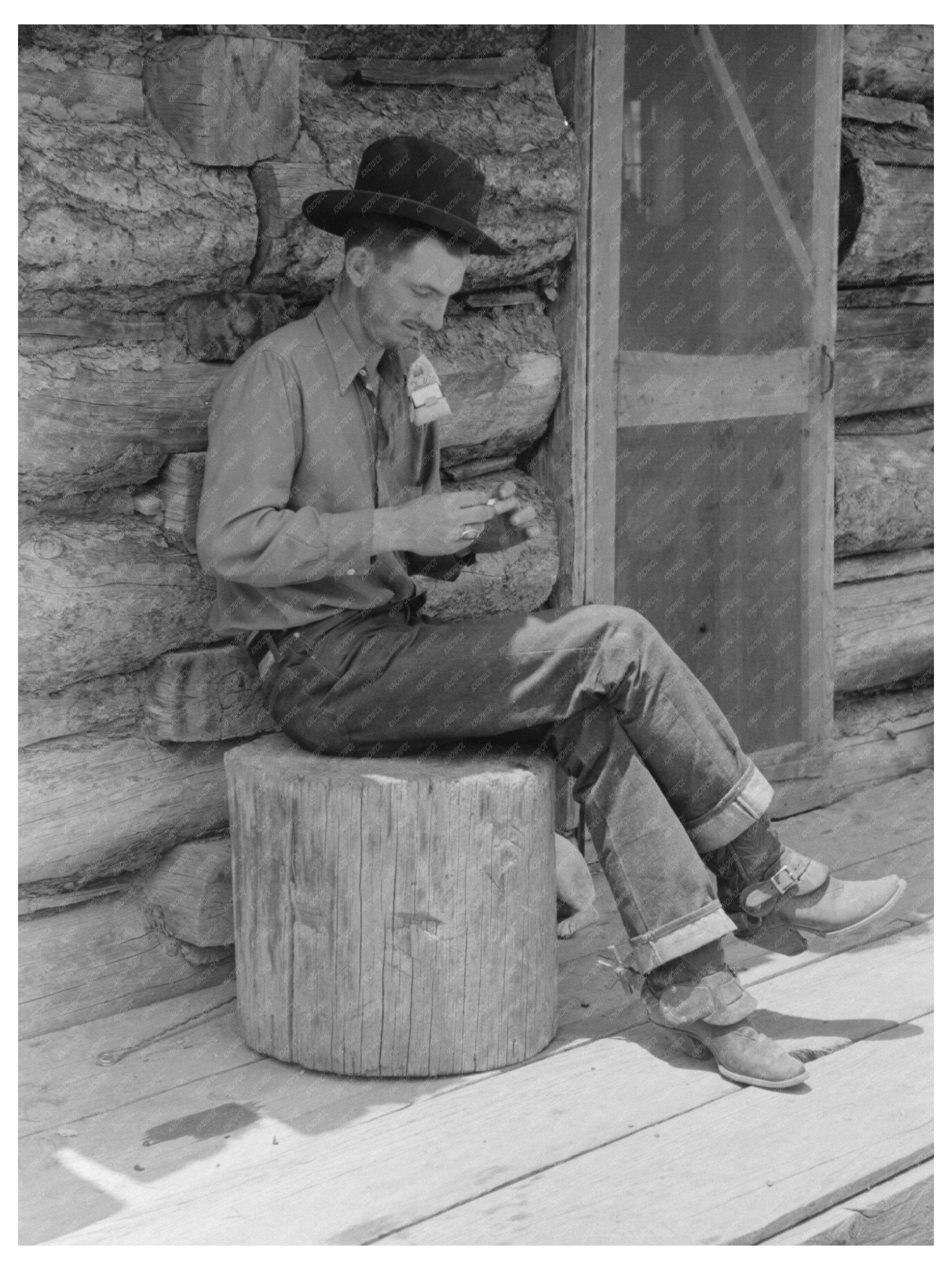 Farmer Rolling Cigarette Outside Log House Pie Town 1940