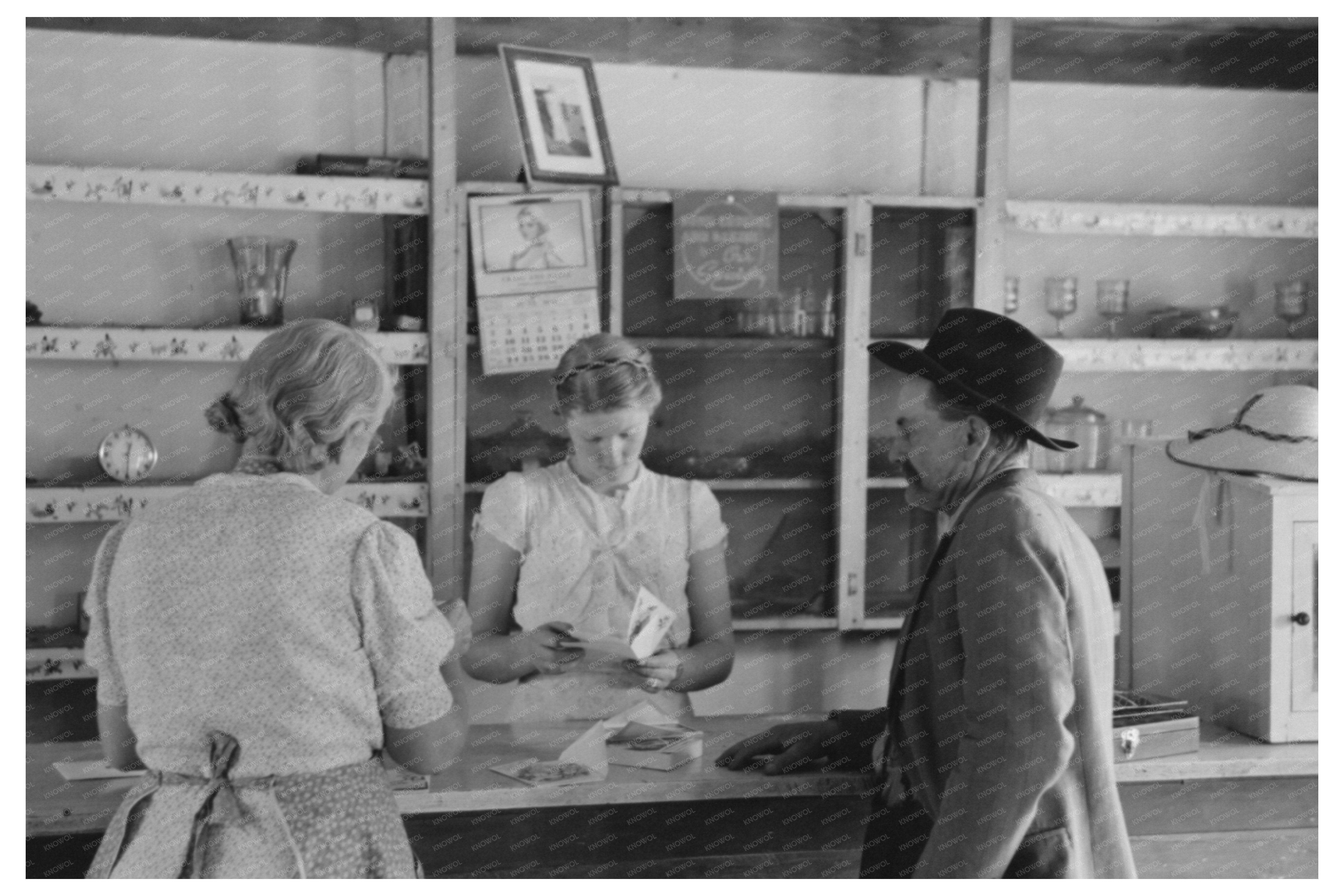 Louis Stagg and Mother Examine Cards in Pie Town 1940