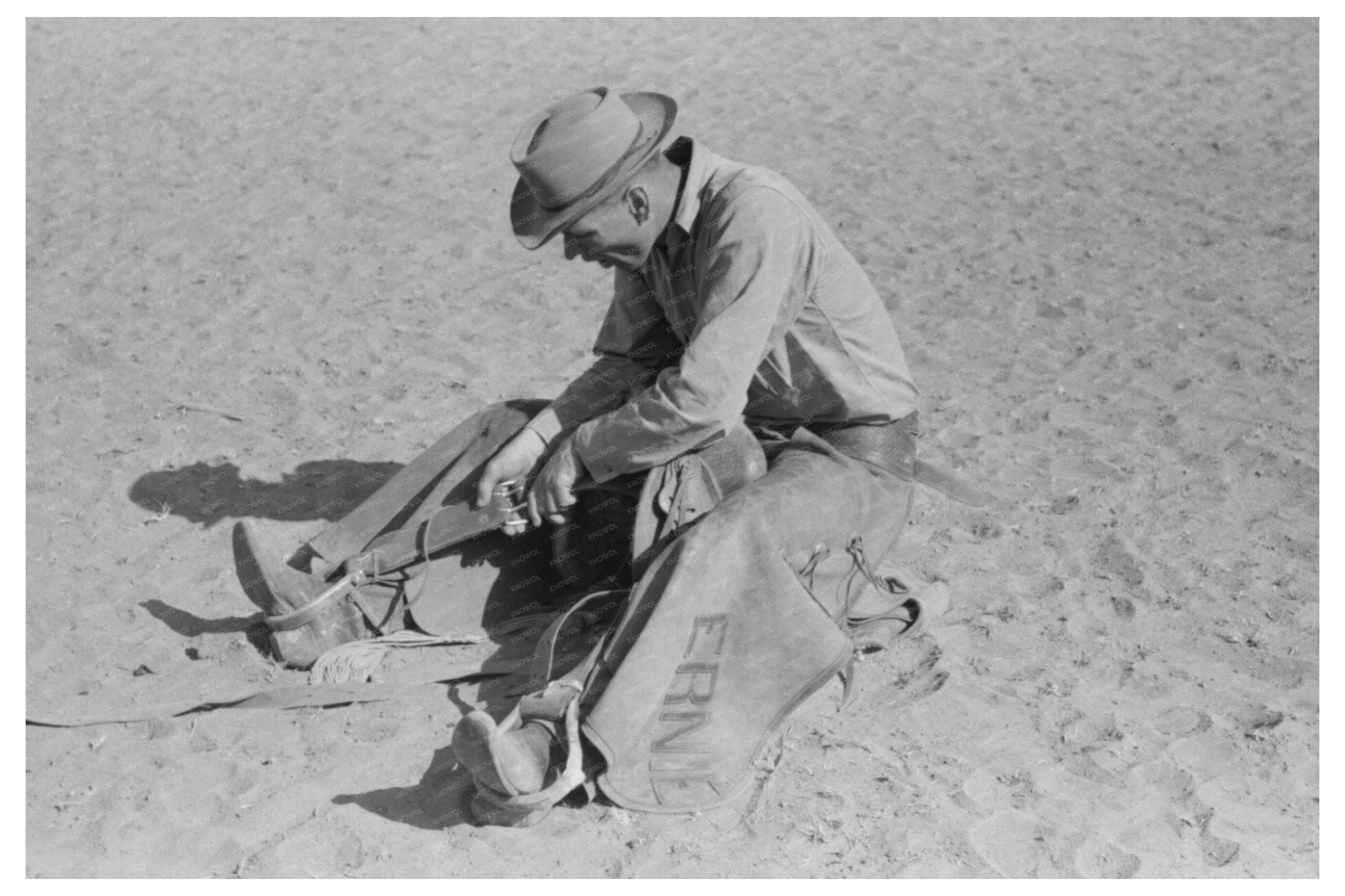 Cowboy Testing Stirrup for Bronc Riding Quemado NM 1940