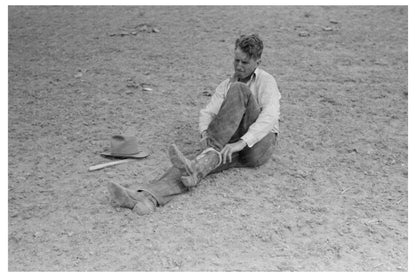 Cowboy Pulling On Boots in Quemado New Mexico 1940