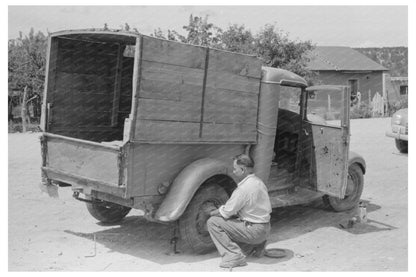 Merchant Changing Tire on Truck Penasco New Mexico 1940