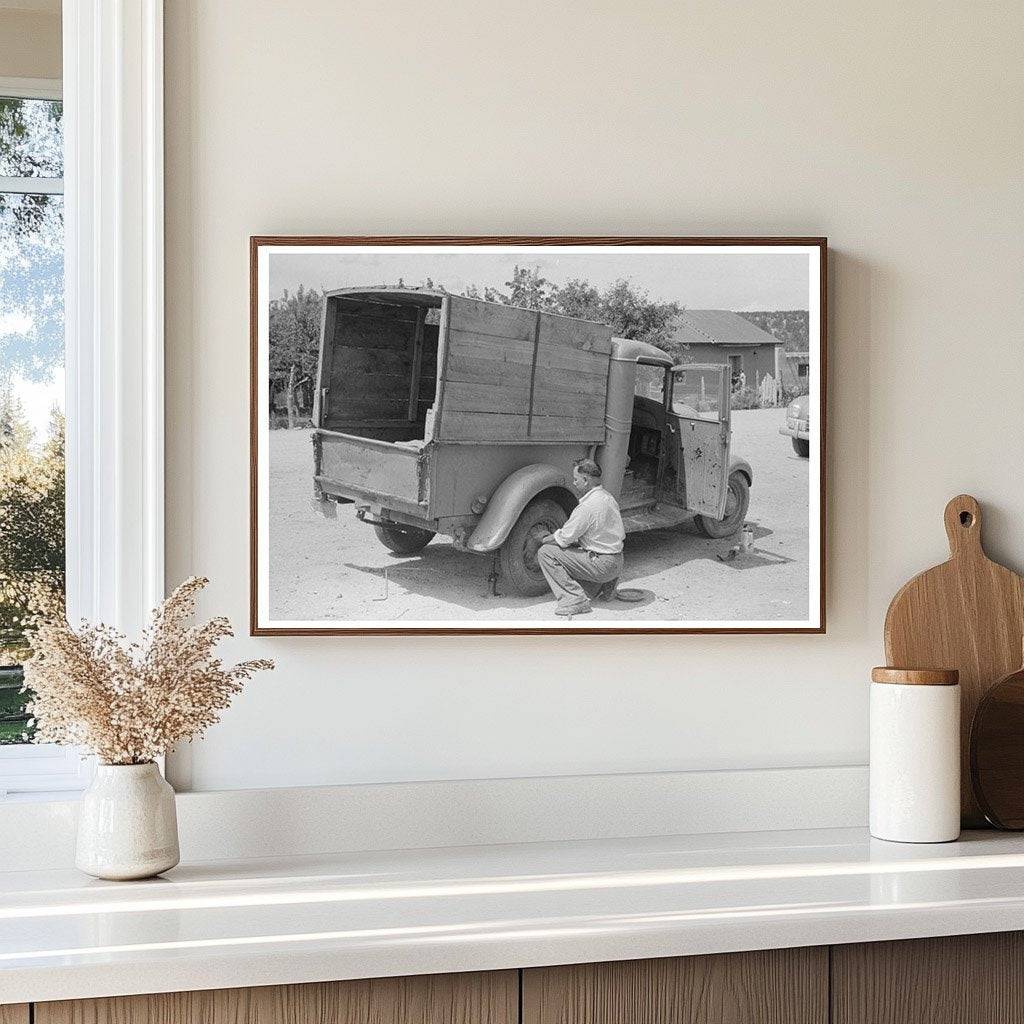 Merchant Changing Tire on Truck Penasco New Mexico 1940