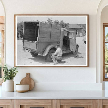 Merchant Changing Tire on Truck Penasco New Mexico 1940