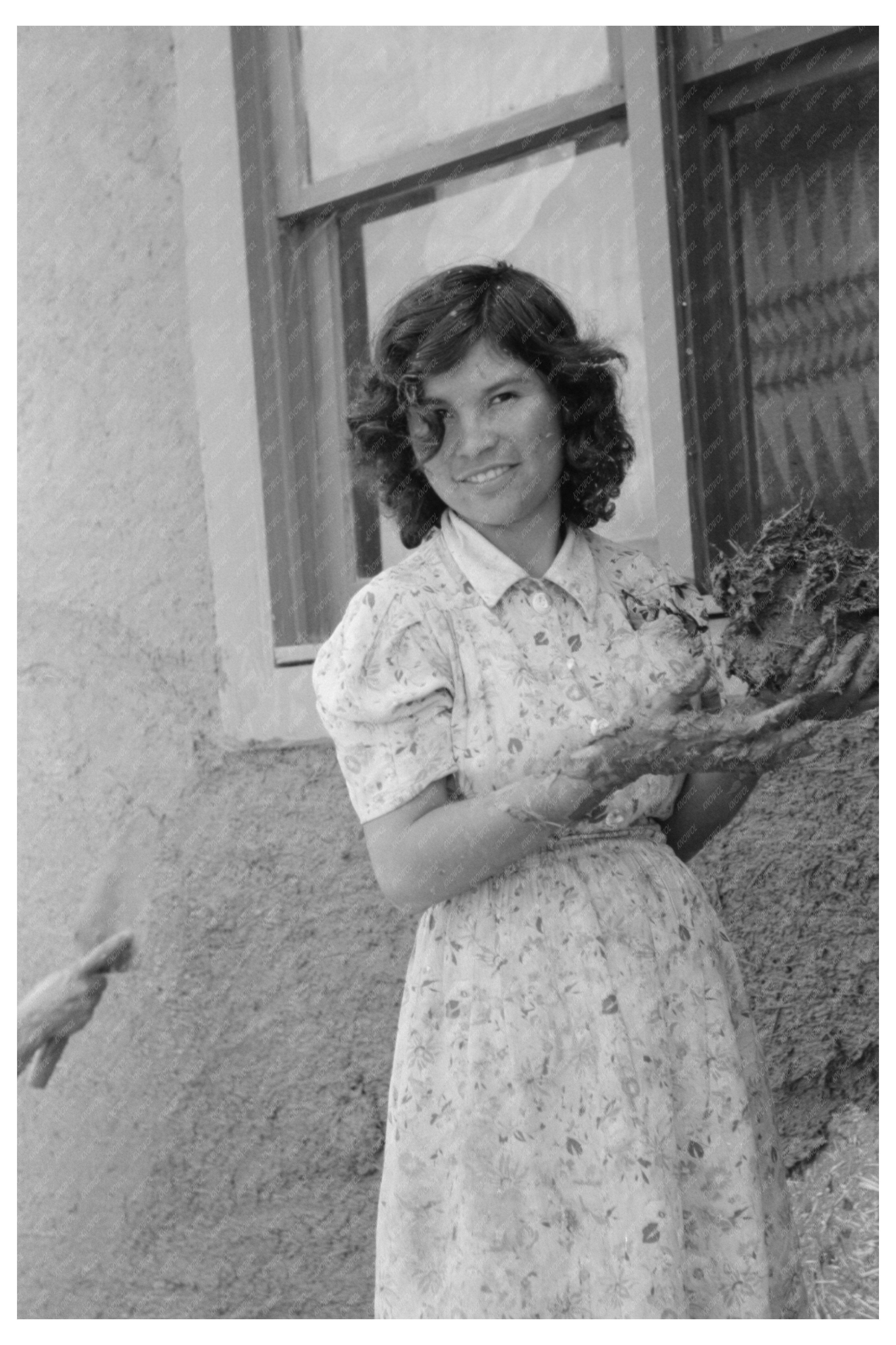 Spanish-American Girl with Adobe Plaster July 1940