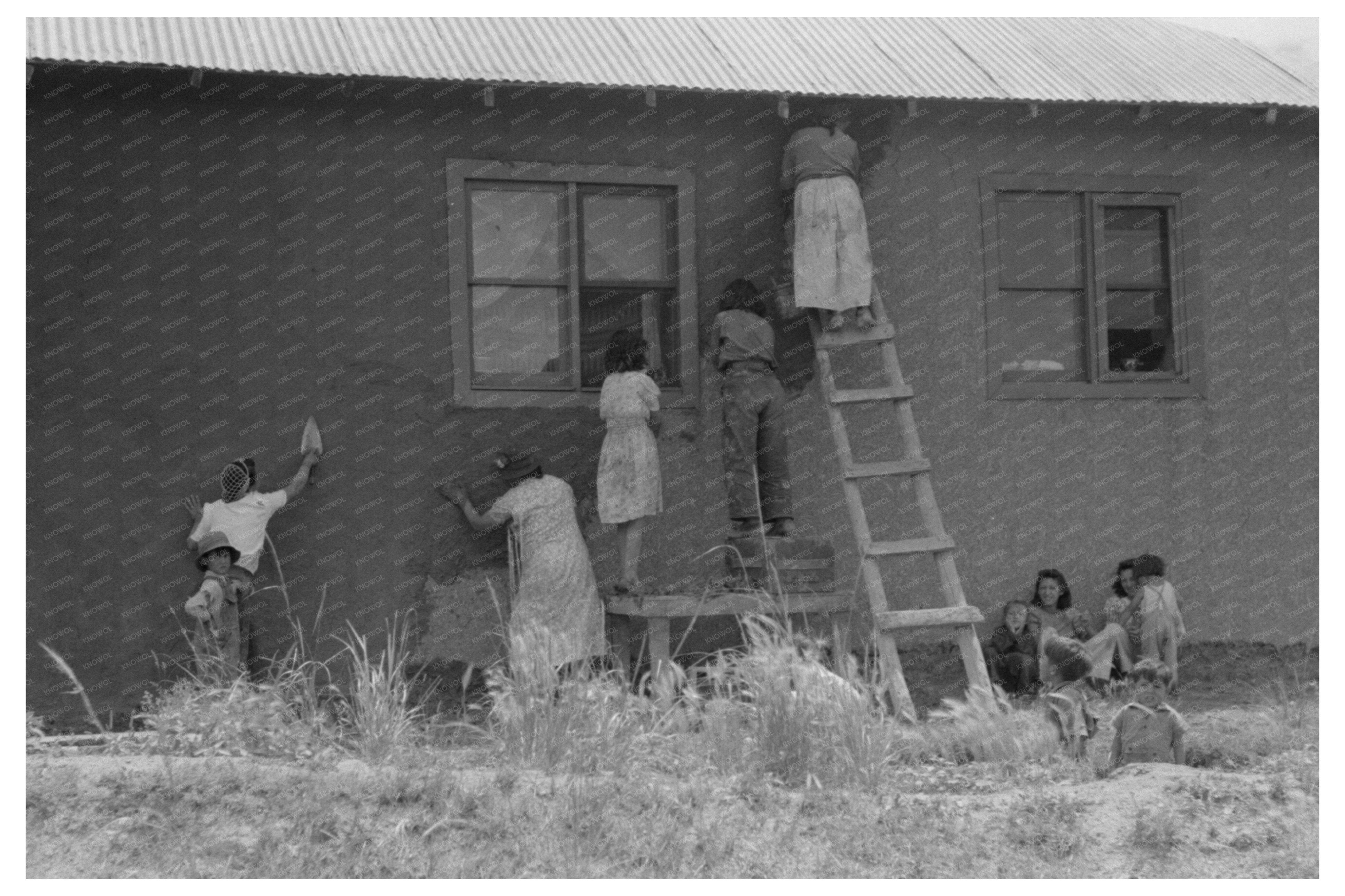 Plastering an Adobe House in Chamisal New Mexico 1940