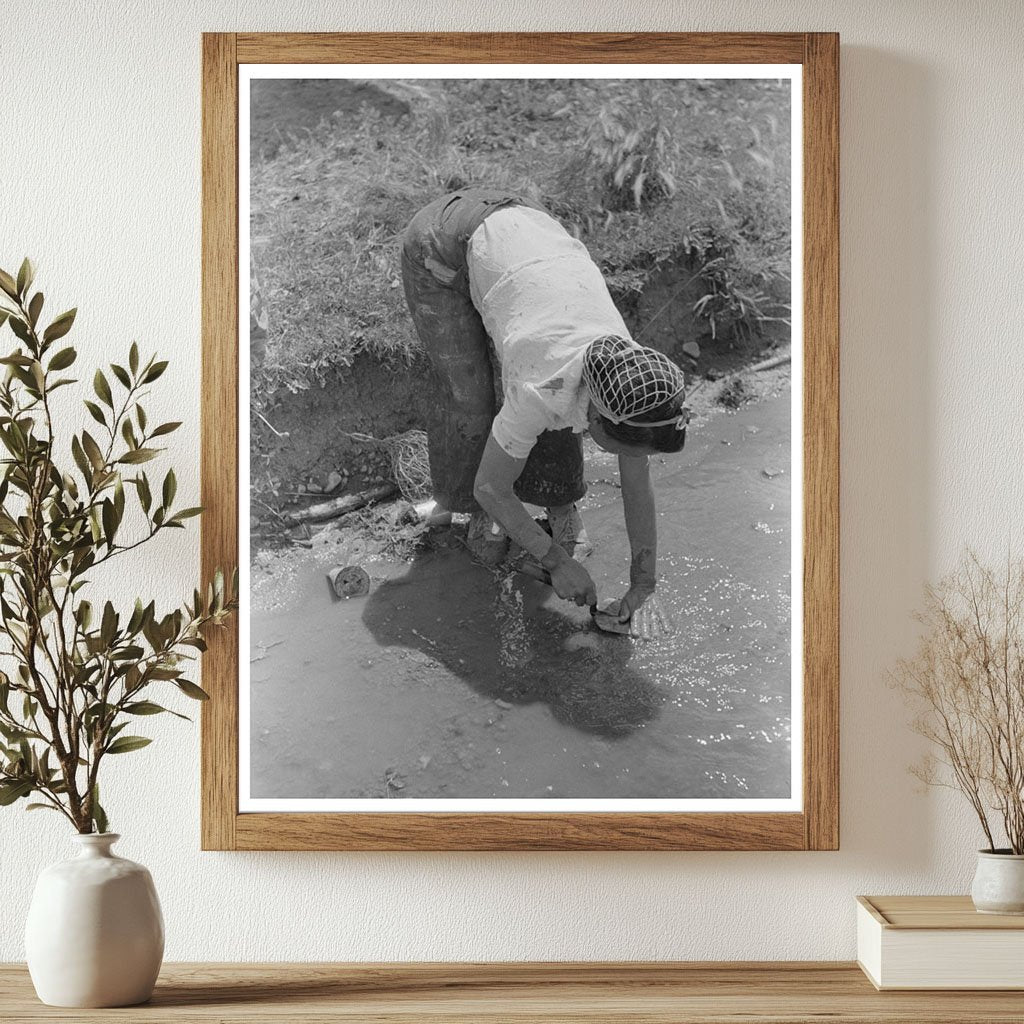 Man Washing Trowel in Chamisal New Mexico July 1940