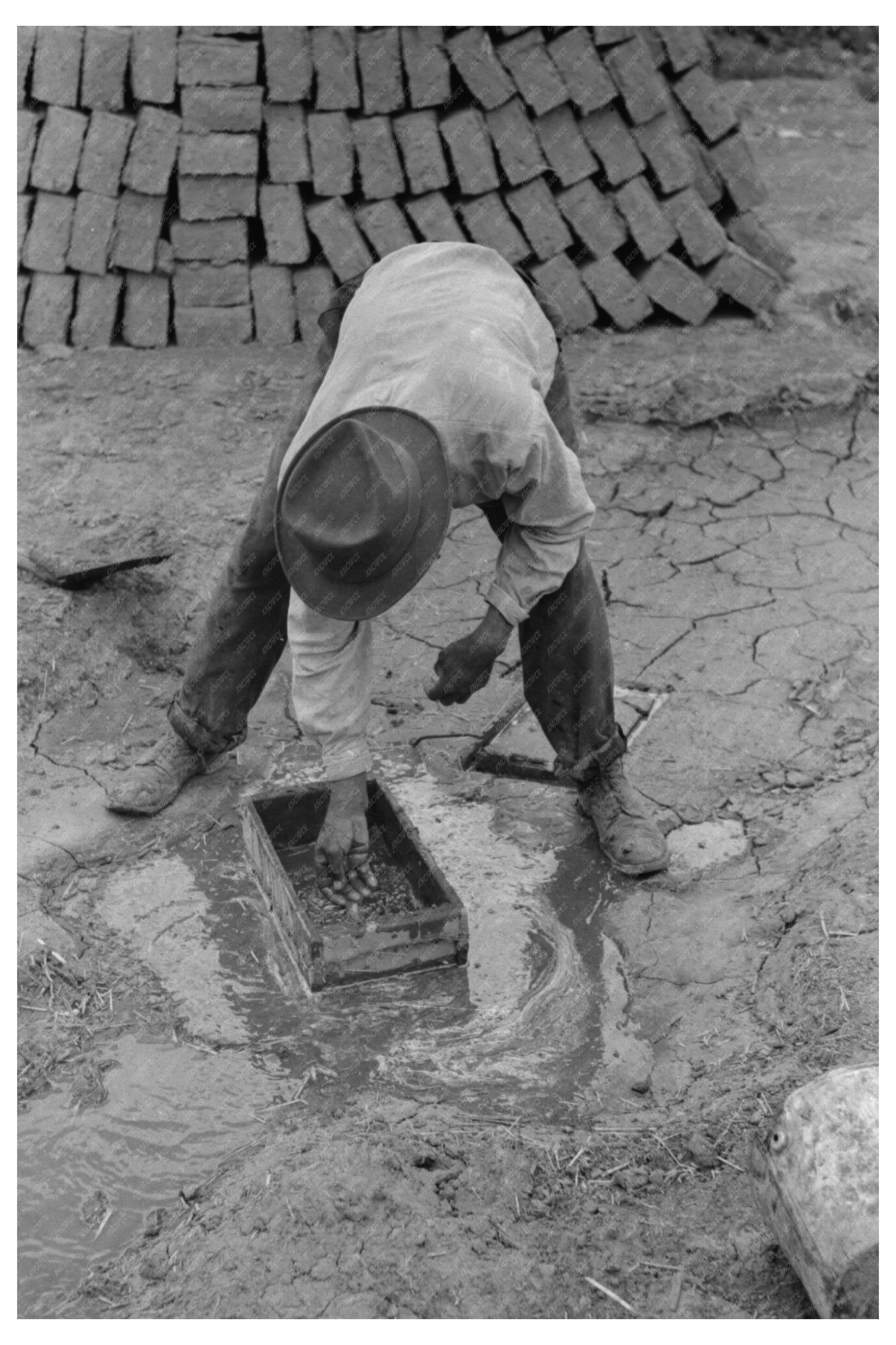 Worker Preparing Wooden Form for Adobe Bricks 1940