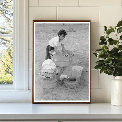 Daughter of Farmer Washing Clothes Chamisal New Mexico 1940