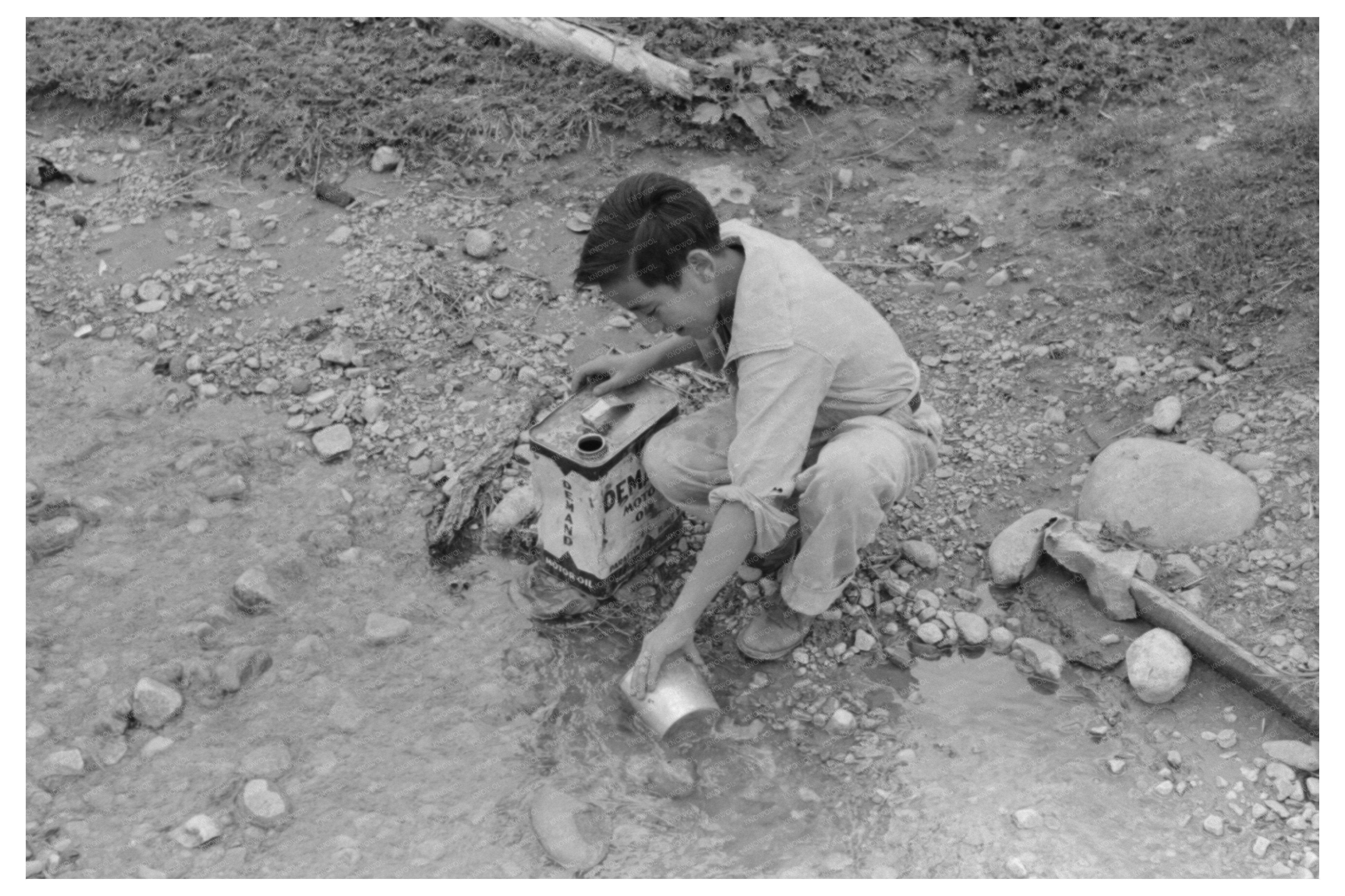 Spanish-American Boy Drawing Water in Chamisal 1940