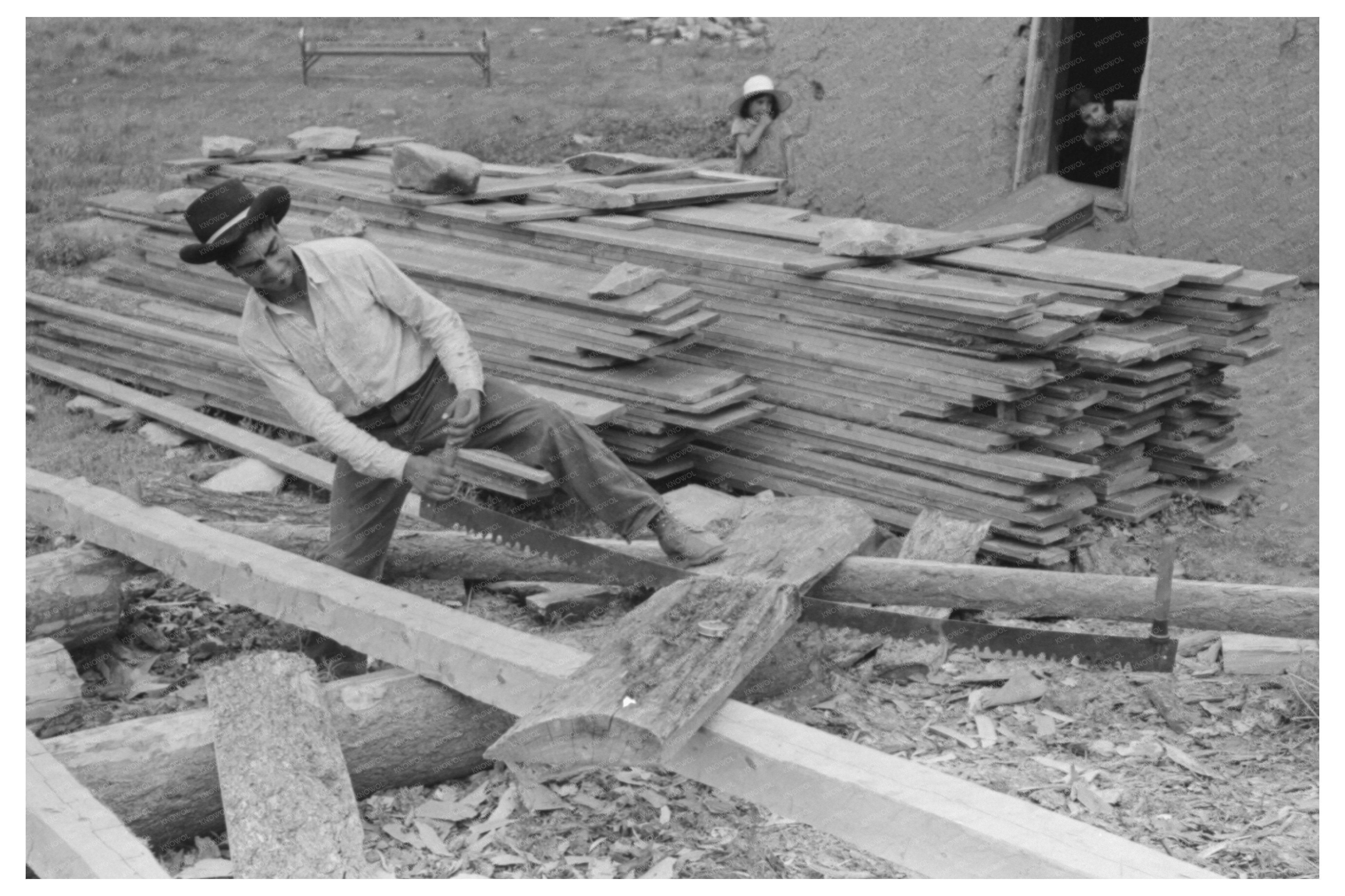 Spanish-American Farmers Son Sawing Wood July 1940
