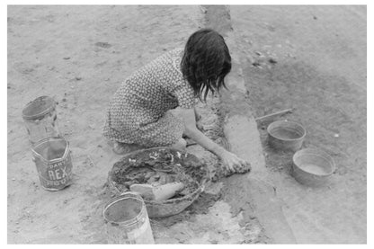 Smoothing Adobe Plaster in Costilla New Mexico 1940