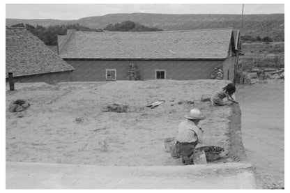 Spanish-American Children Replastering Adobe Roof 1940