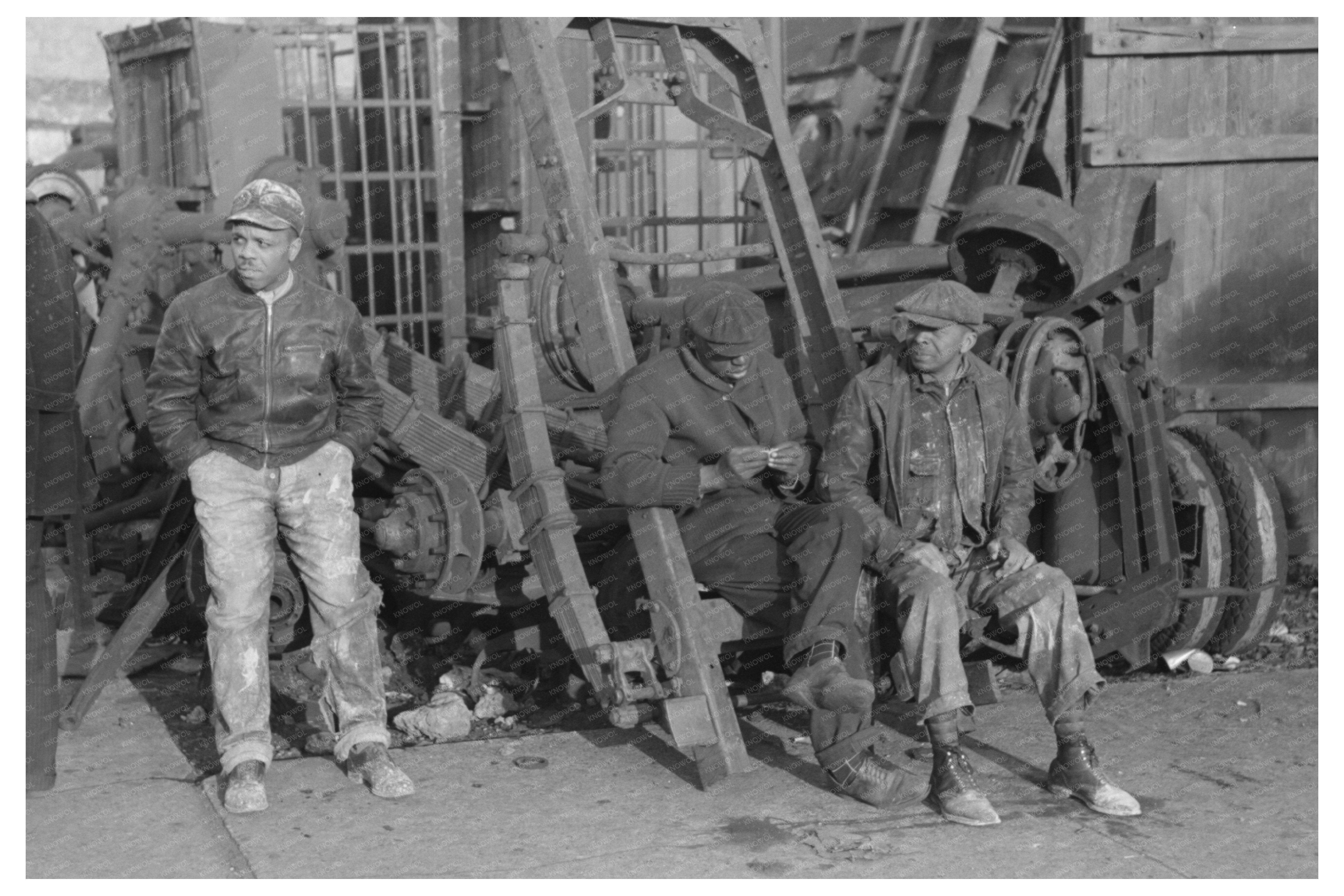 Men Seated on Truck in Chicago Junkyard April 1941