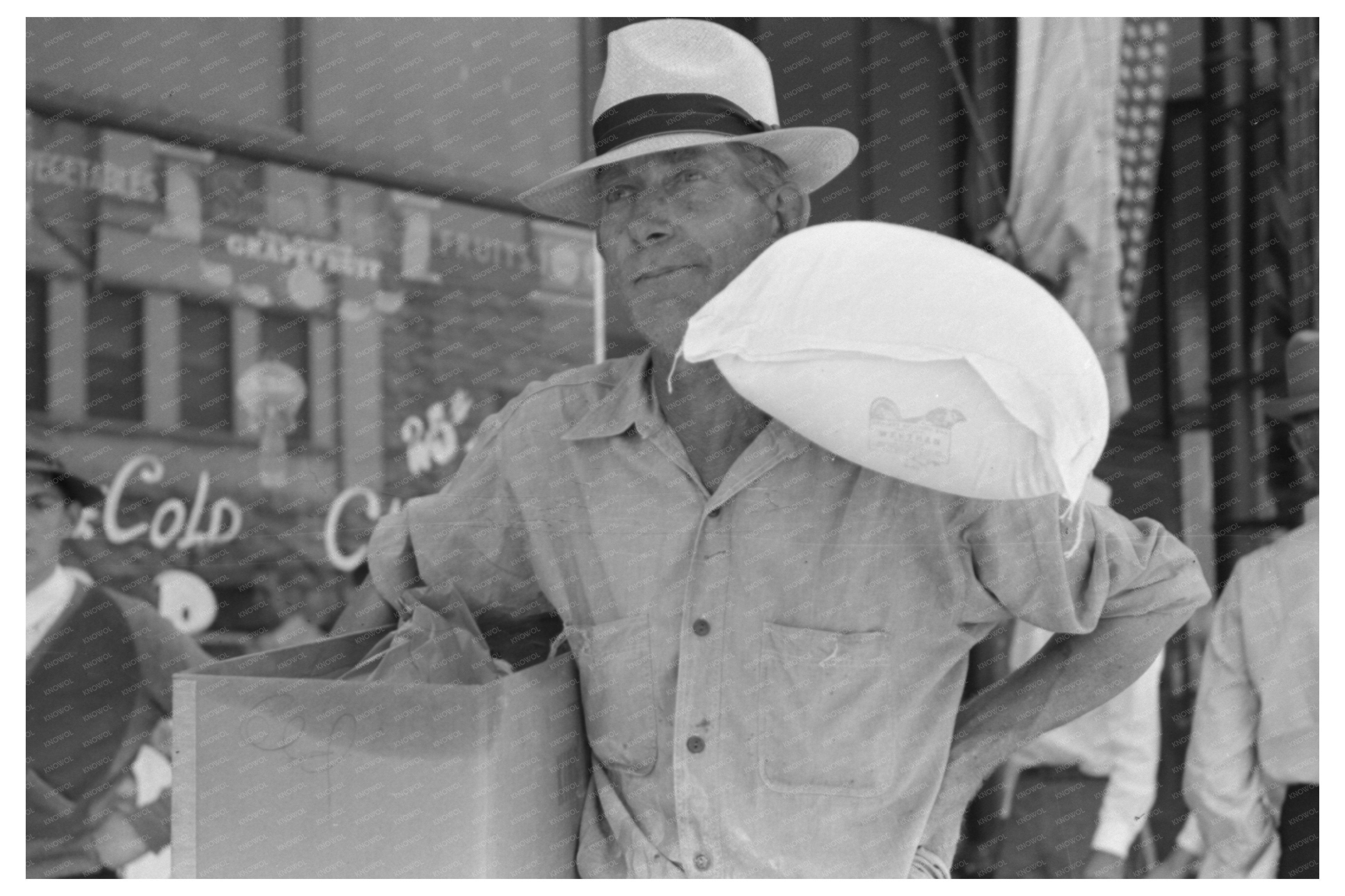 Farmer Exits Grocery Store in Vale Oregon July 1941