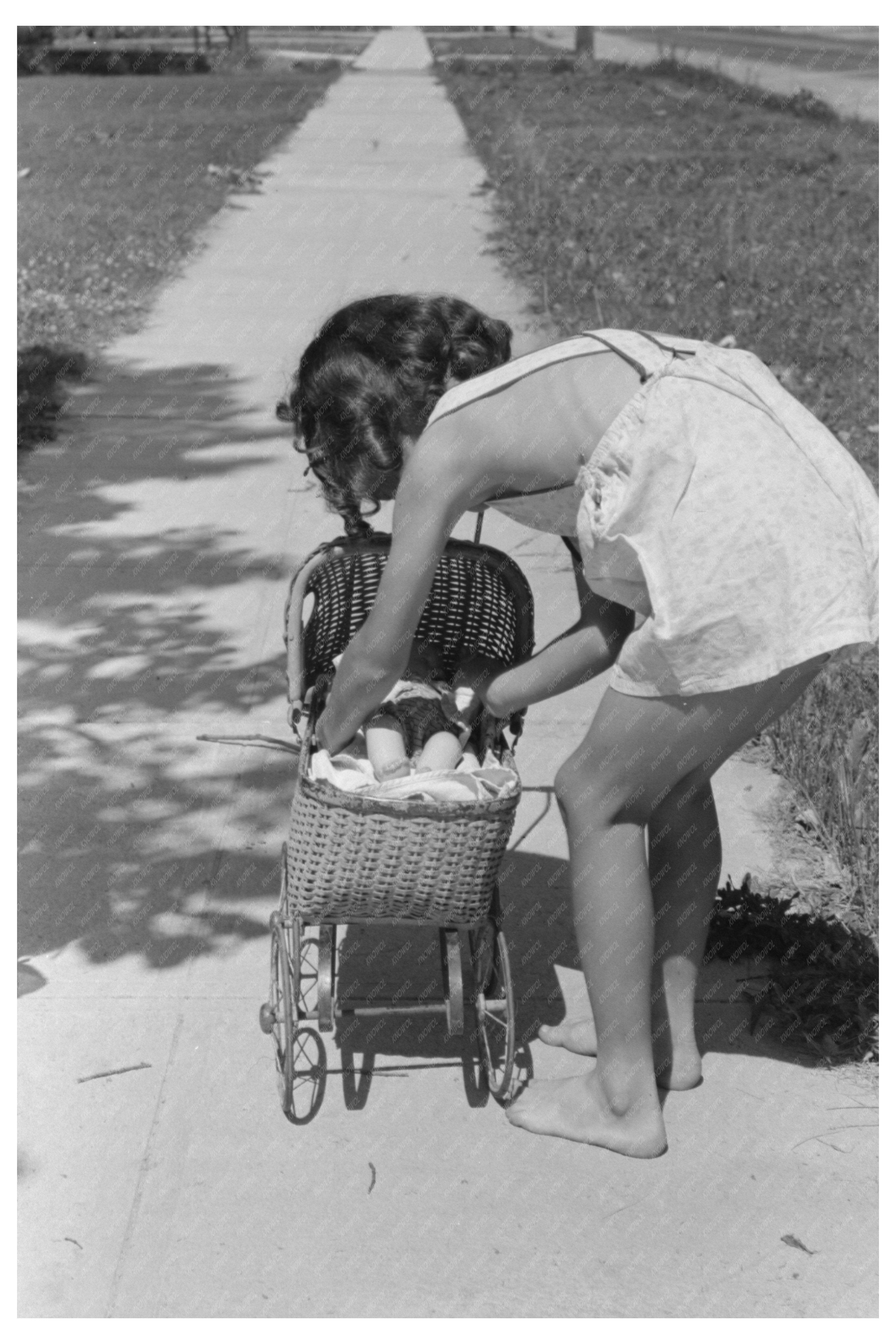 Young Girl Playing with Doll Caldwell Idaho 1941