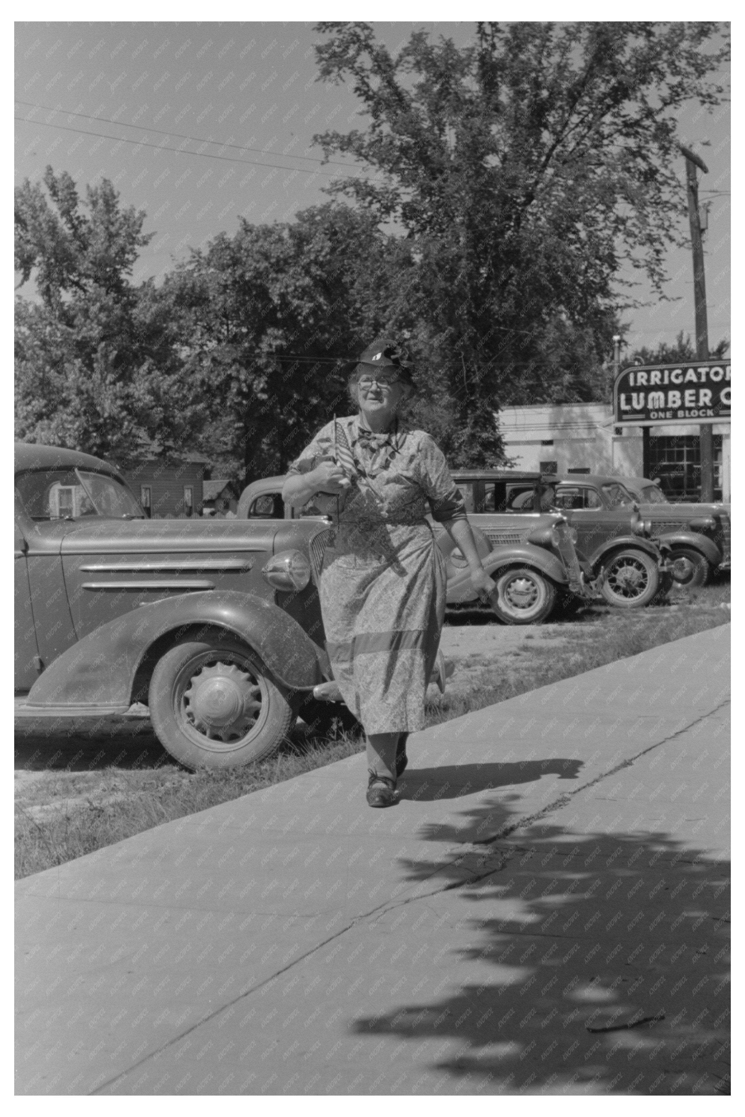 Woman Shopping with Flag for Fourth of July 1941