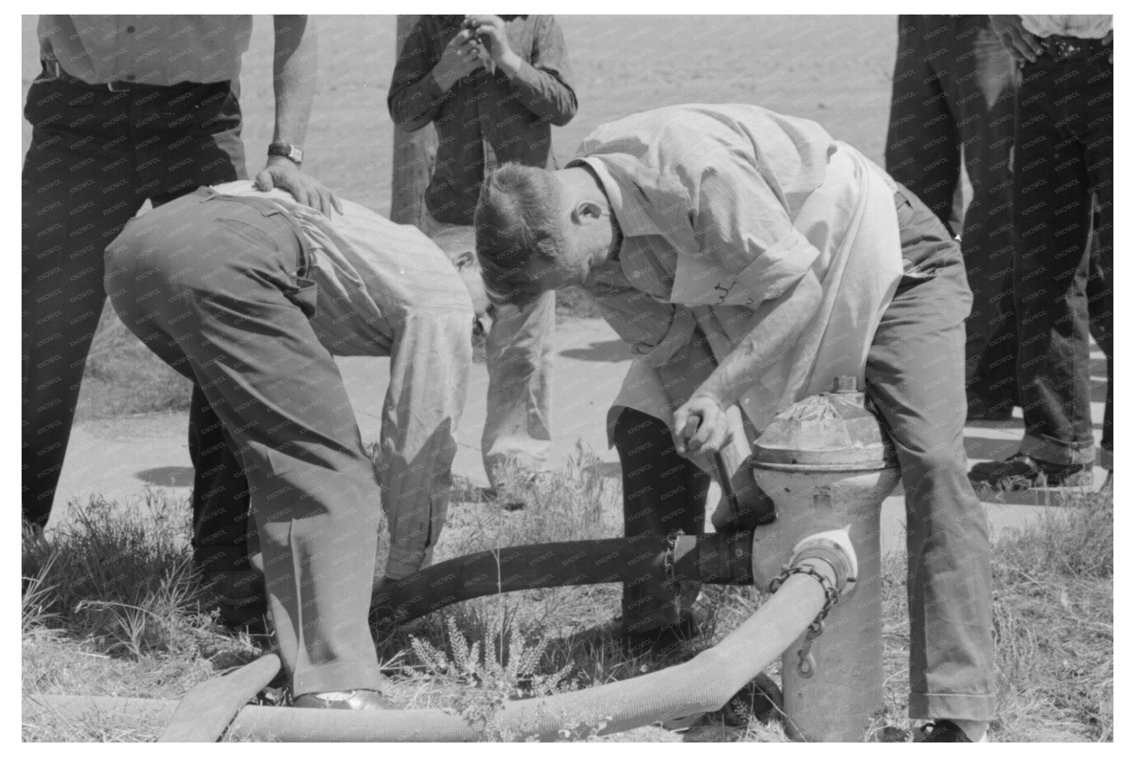 Firefighter Connecting Hose at Grass Fire Vale Oregon 1941