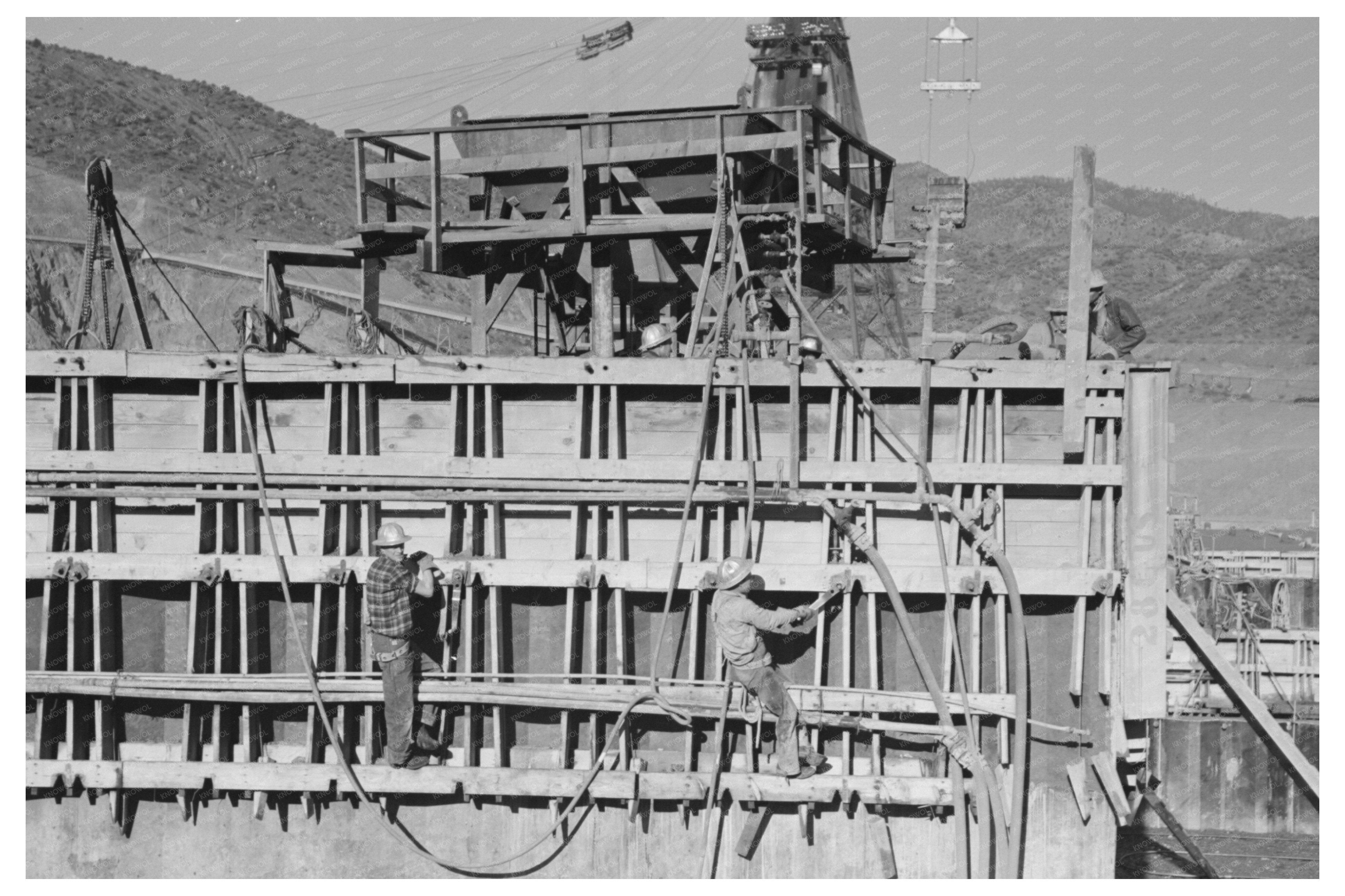 Vibrators Spreading Concrete at Shasta Dam 1941