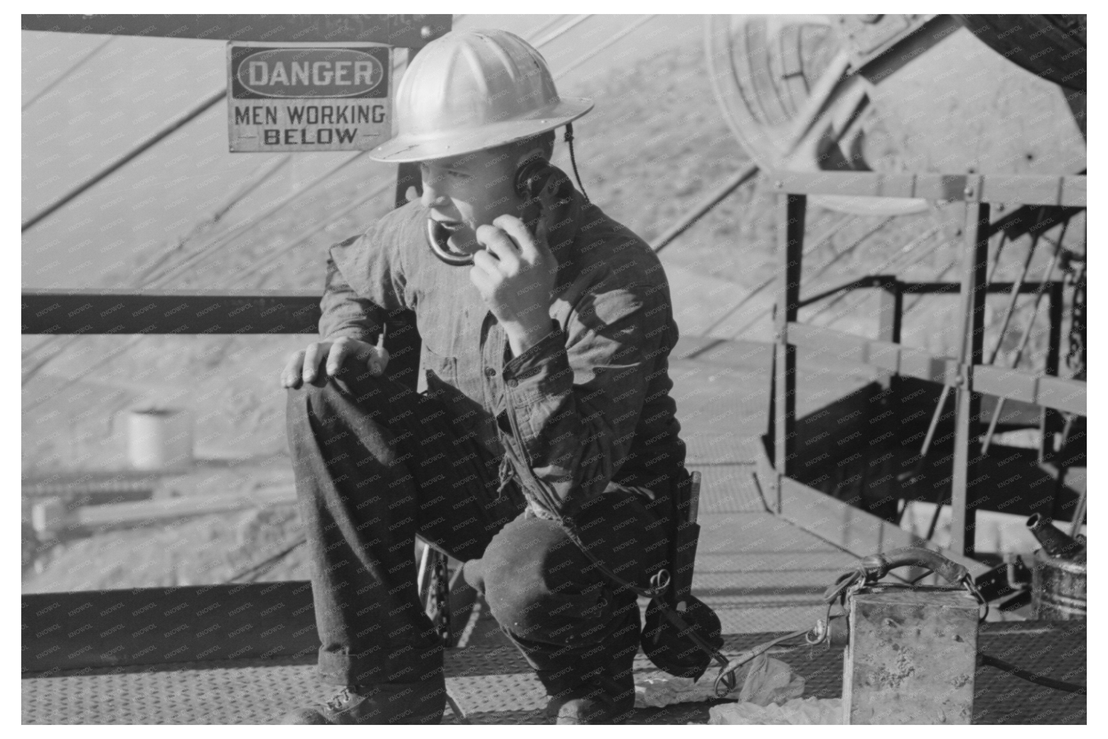 Workman on Telephone at Shasta Dam December 1941