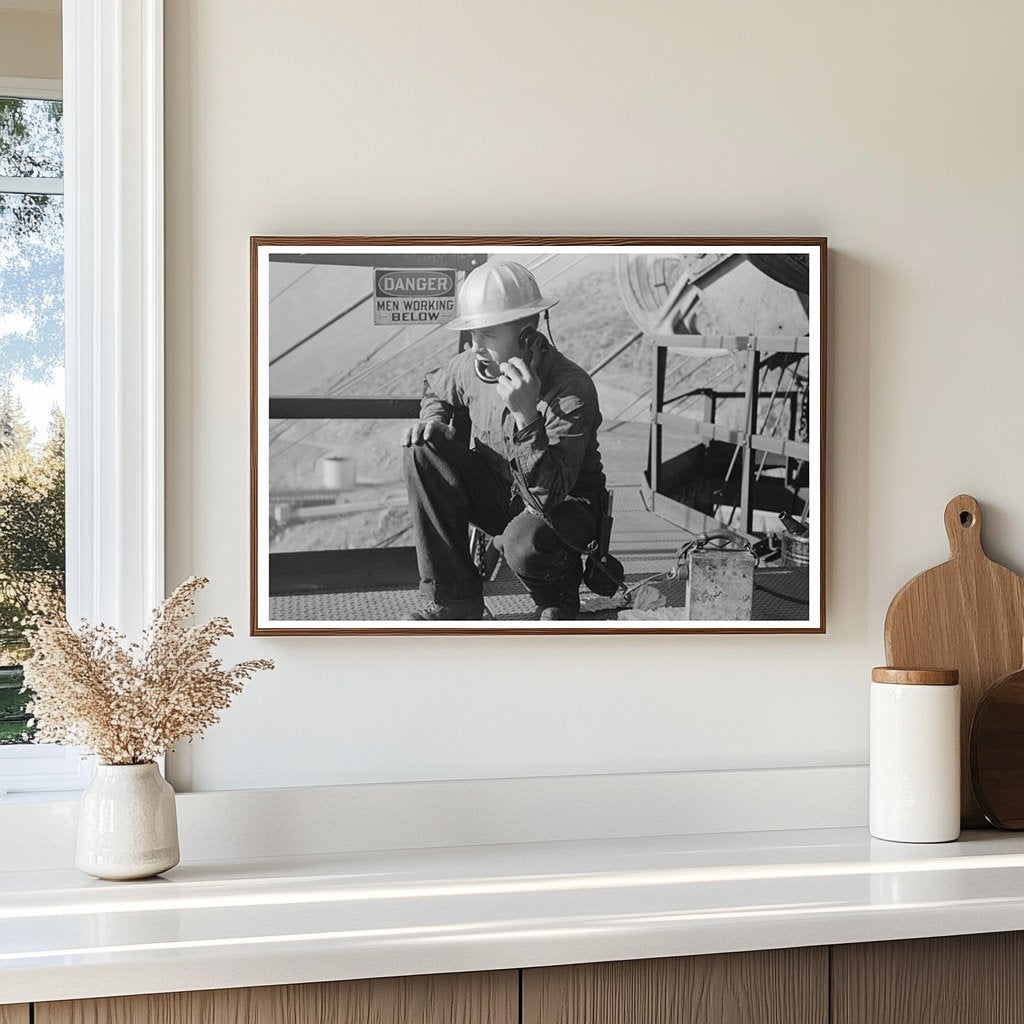 Workman on Telephone at Shasta Dam December 1941