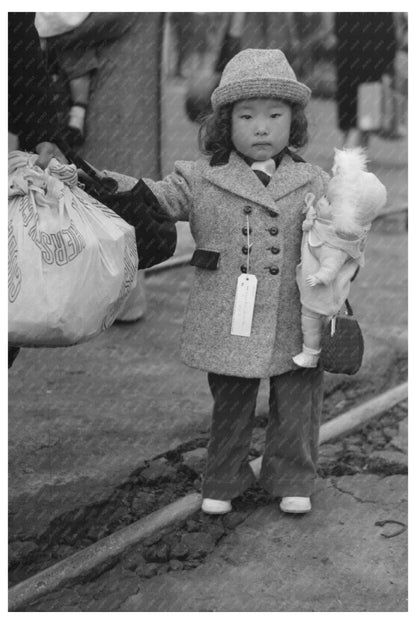 Japanese-American Child Relocating April 1942