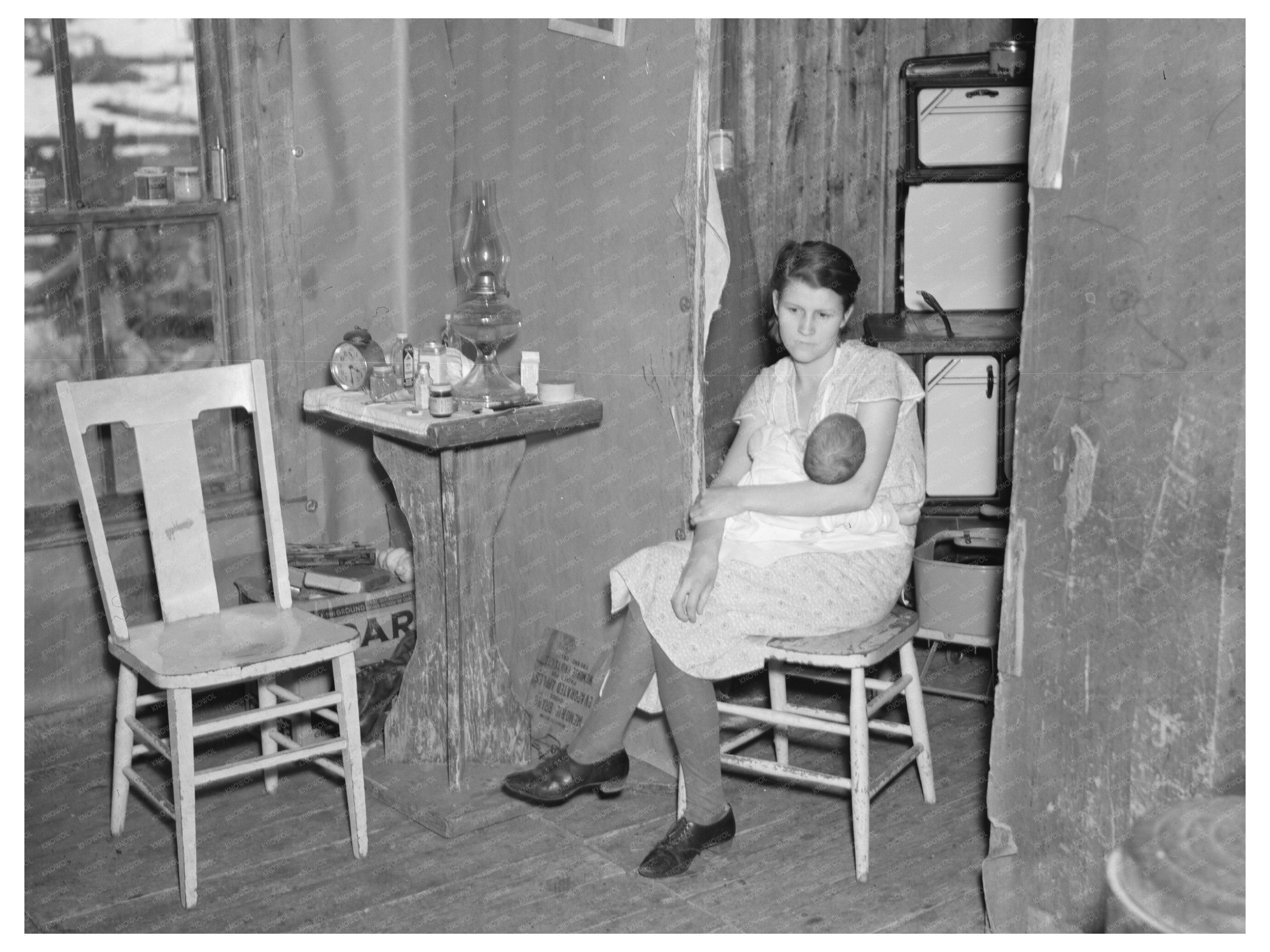 Mrs. Smallwood and Baby in Wisconsin Shack April 1937