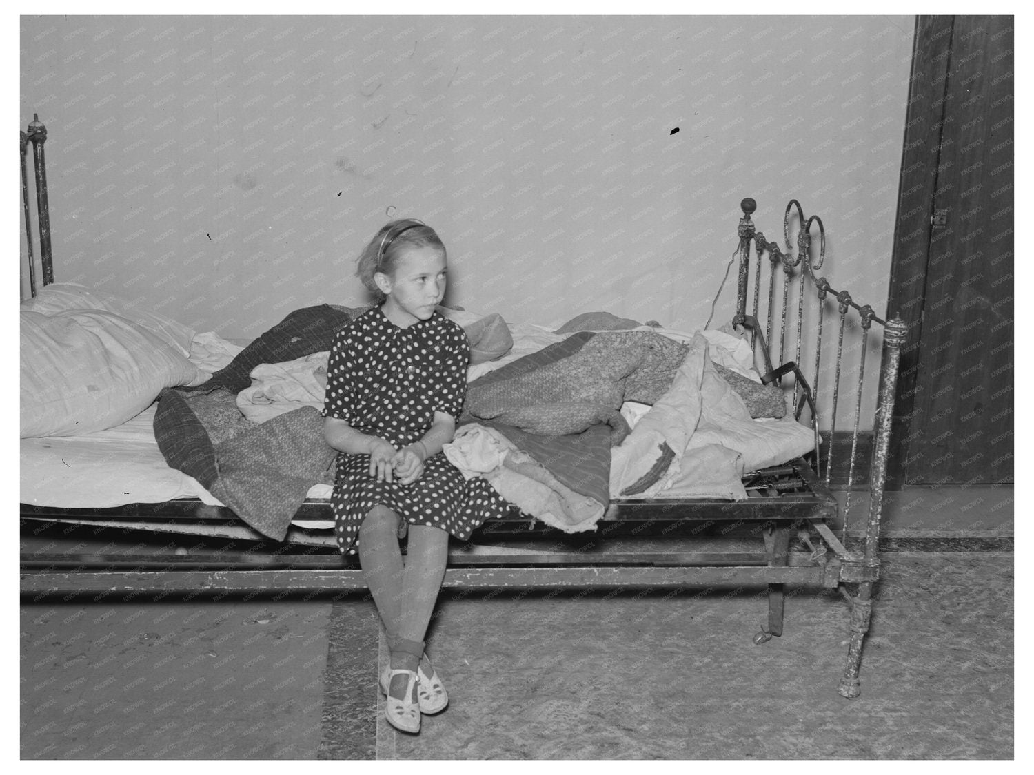 Daughter of A.O. Ryland with Quilts in 1937 North Dakota
