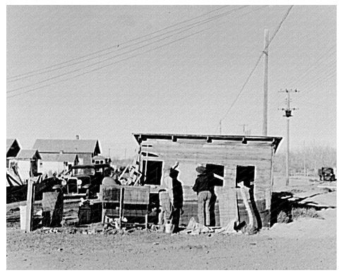 George Jackson and Son Repairing Building in Montana 1937