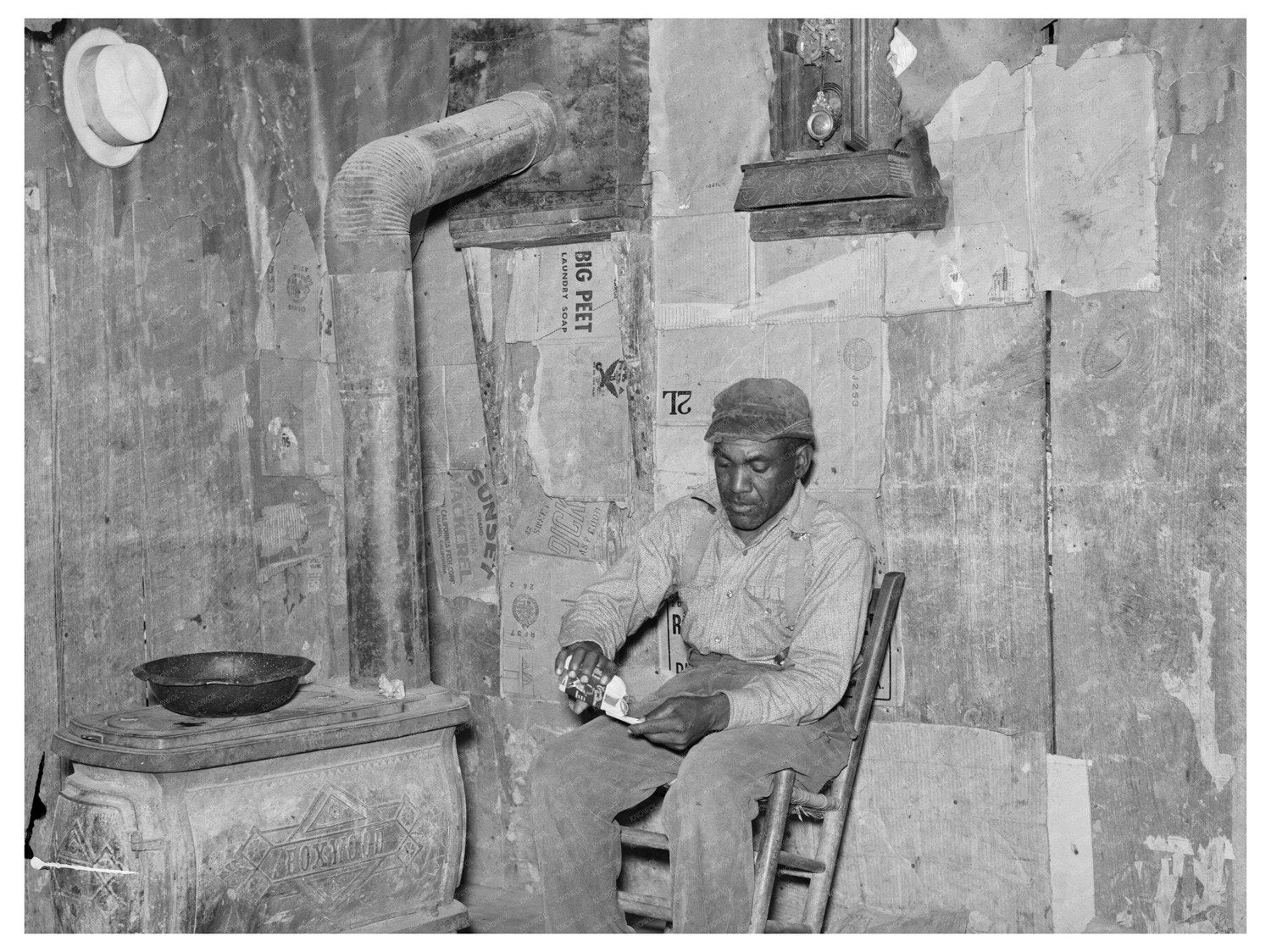 Sharecropper Rolling Cigarette in Missouri Shack 1938