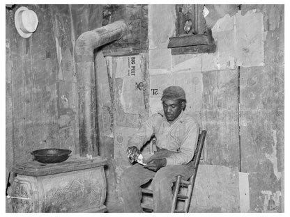 Sharecropper Rolling Cigarette in Missouri Shack 1938