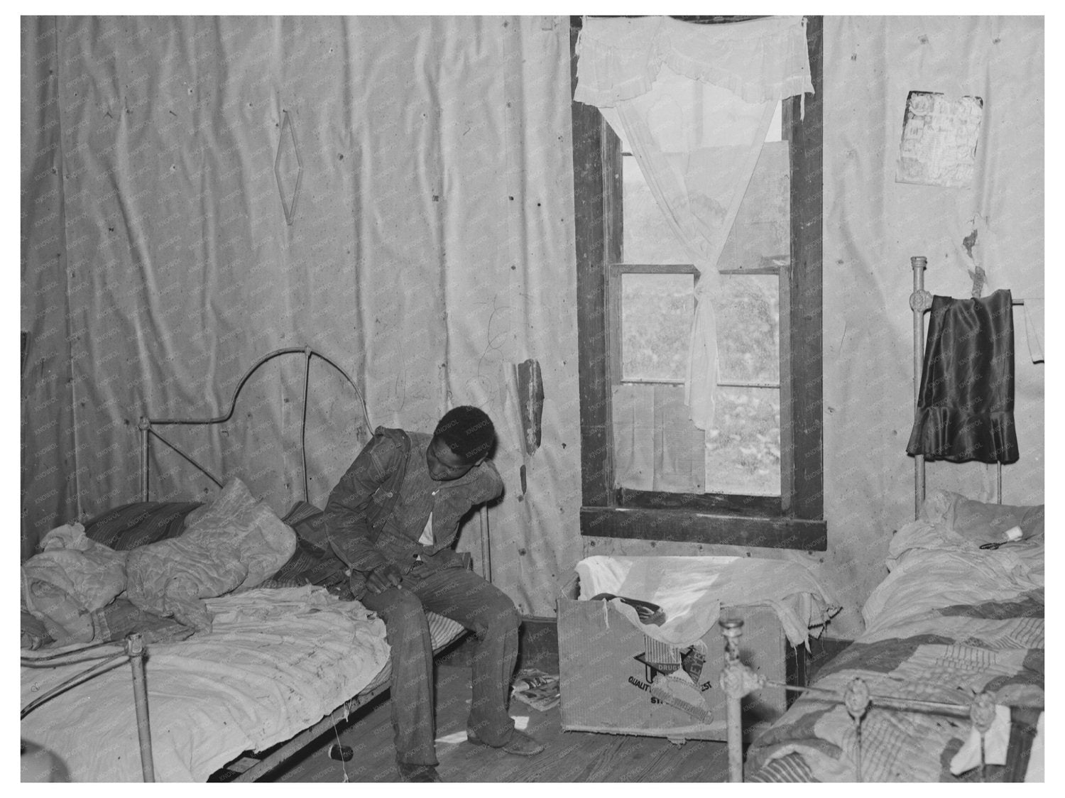 Young Boy Dressing in Sharecroppers Shack May 1938