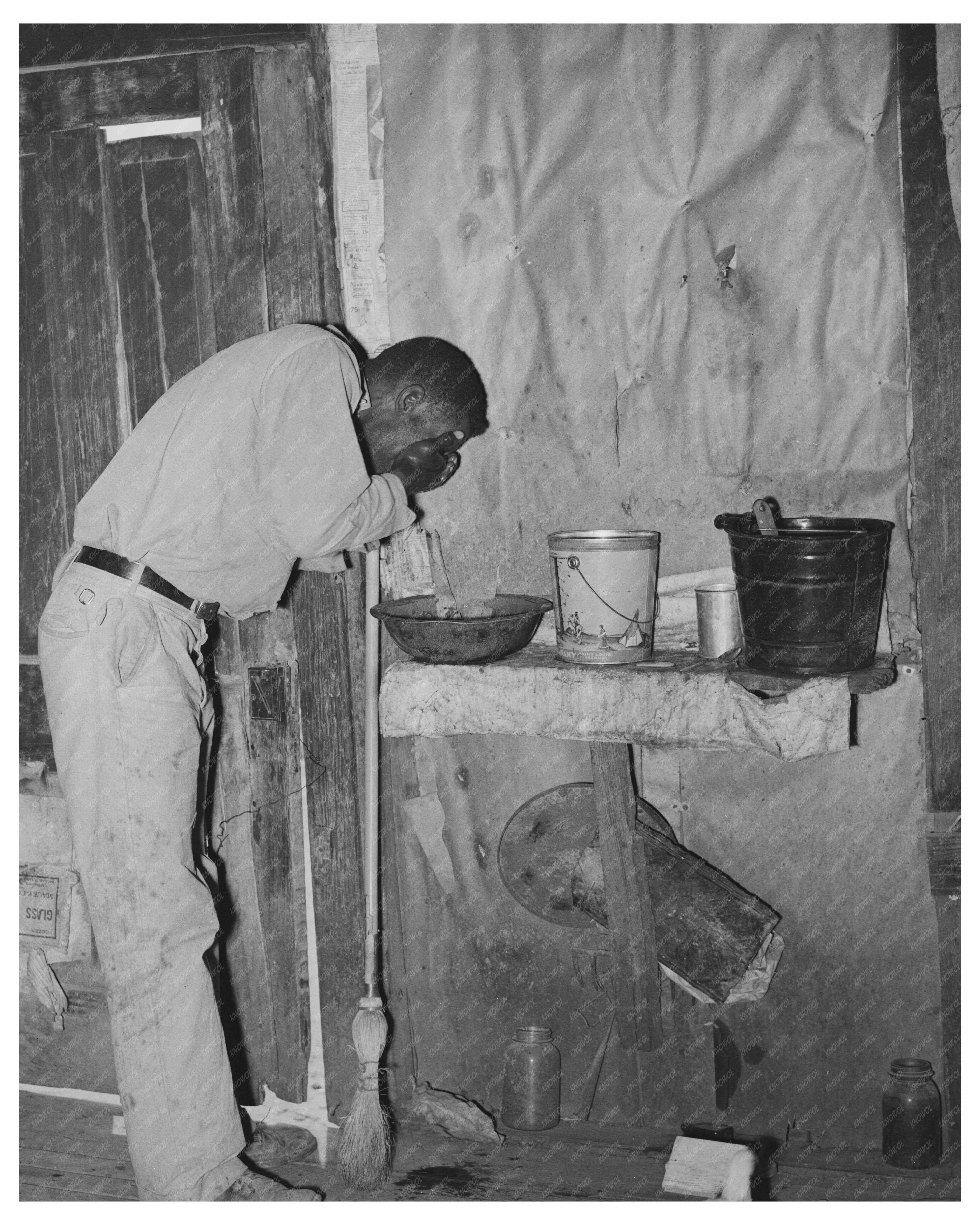 Former Sharecropper Washing Face New Madrid County 1938