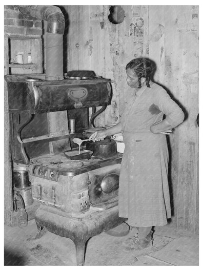 Woman Preparing Gravy in Sharecropper Cabin May 1938