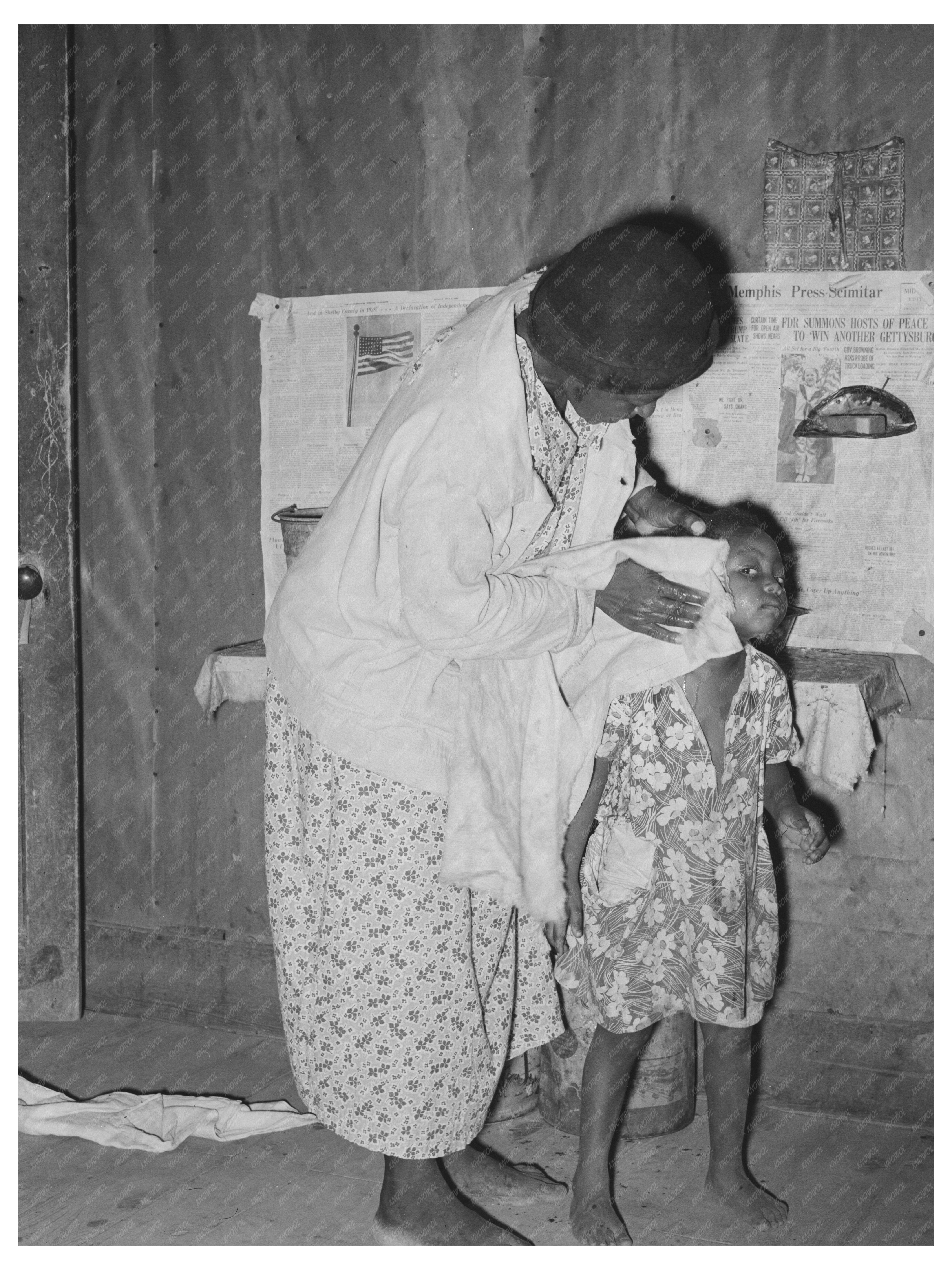 Woman Washing Daughters Face in Rural Missouri 1938