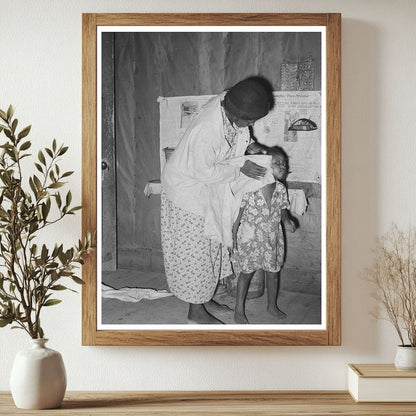 Woman Washing Daughters Face in Rural Missouri 1938