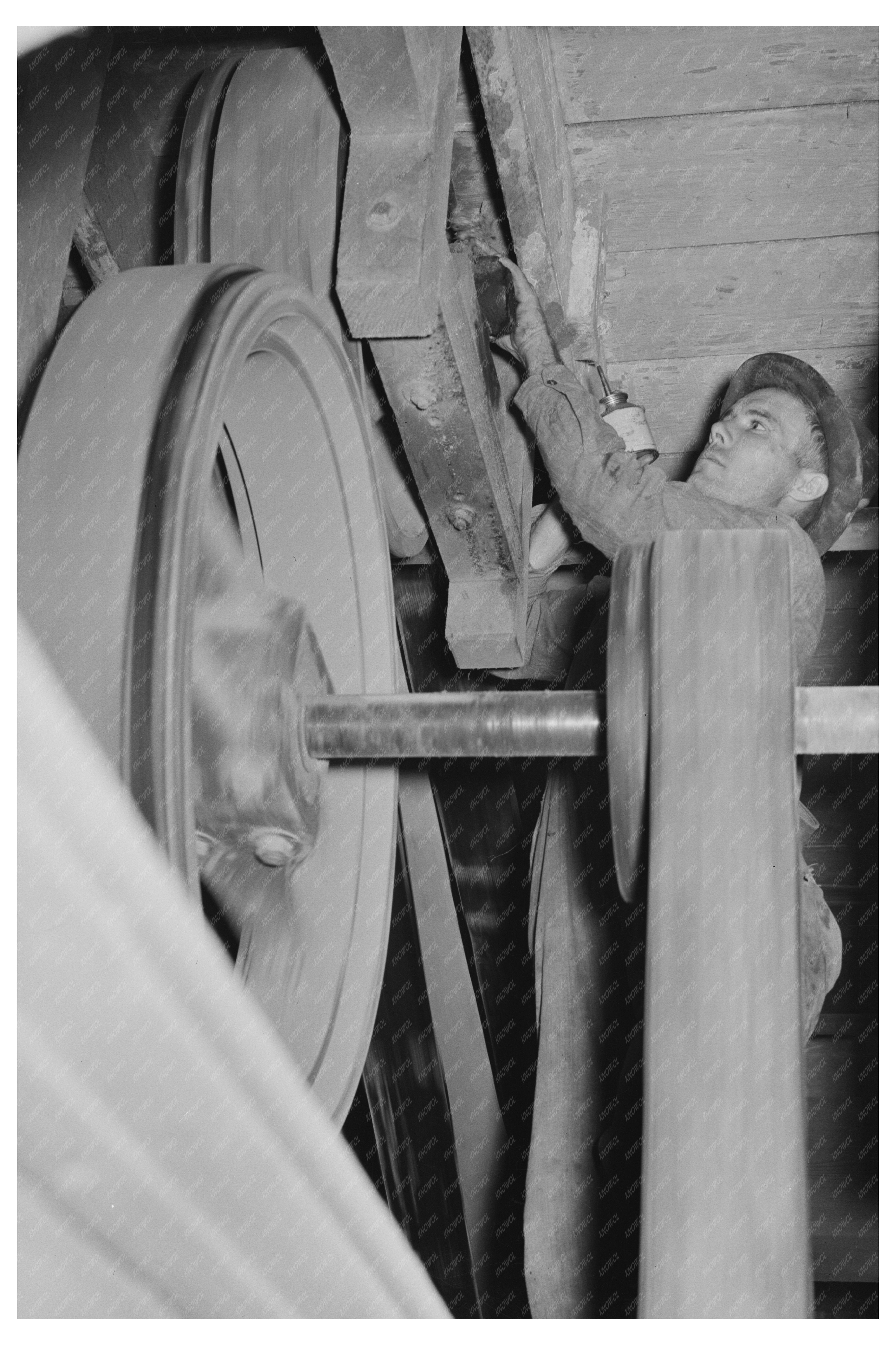 Workers Oiling Pulleys in Rice Mill Crowley Louisiana 1938