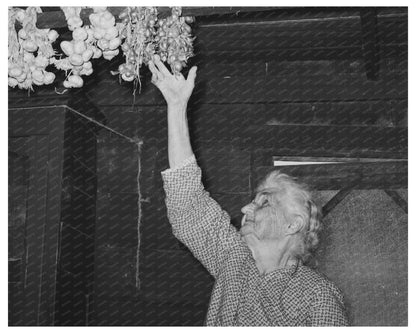 Cajun Woman Reaching for Garlic Crowley Louisiana 1938