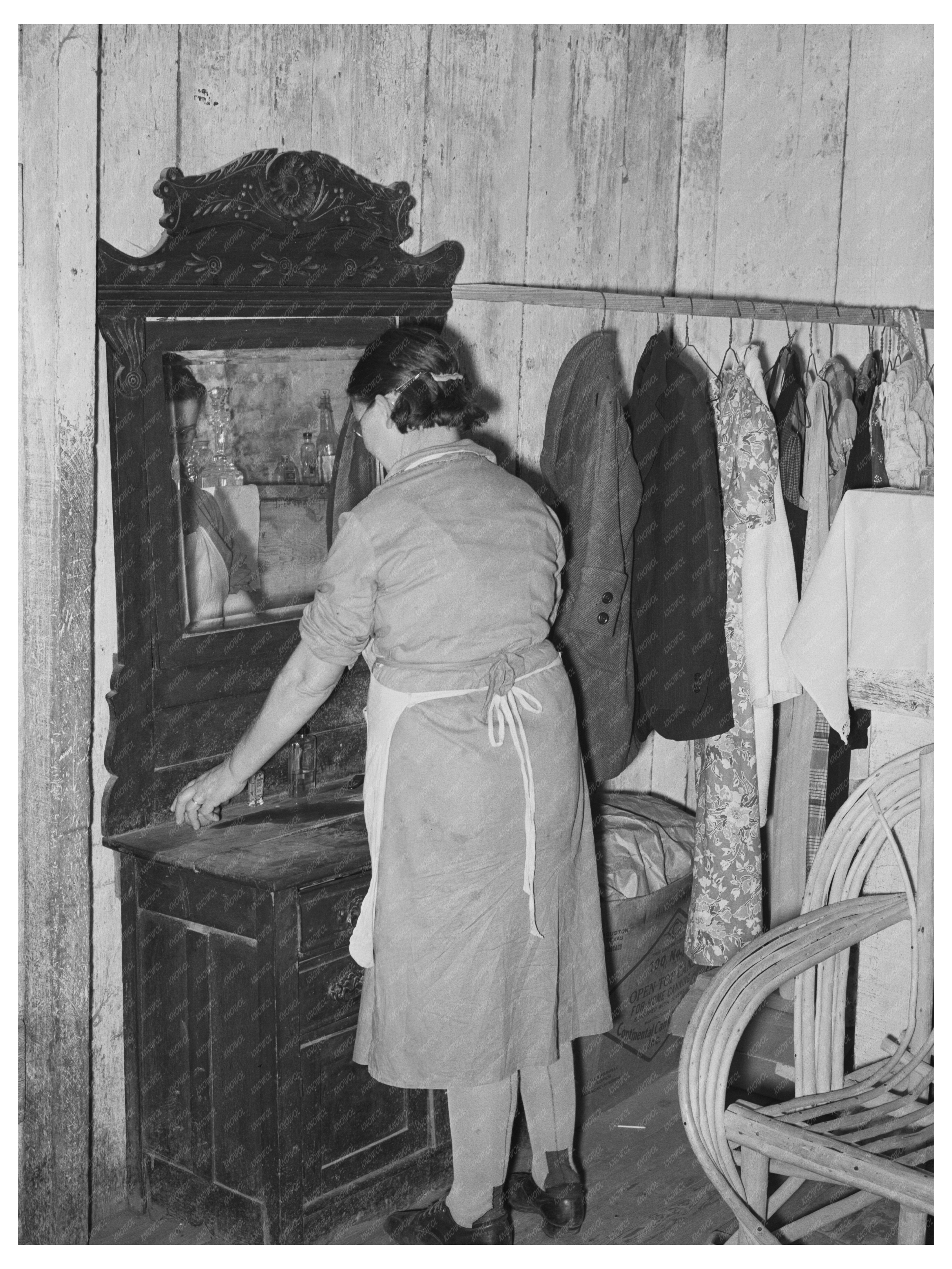 Mrs. M. LaBlanc Arranging Dresser in Morganza 1938