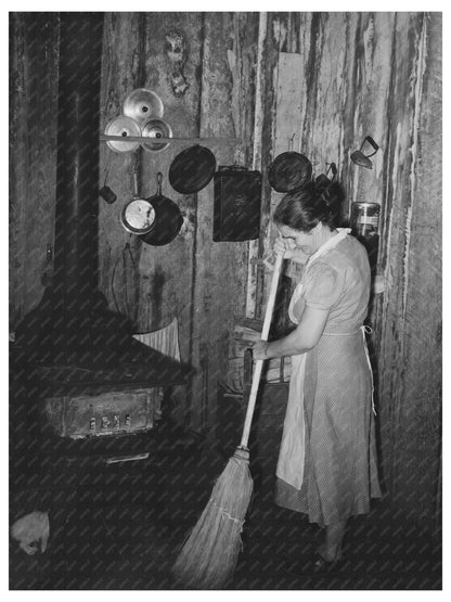 Mrs. Emil Kimball Sweeping in Morganza Louisiana 1938