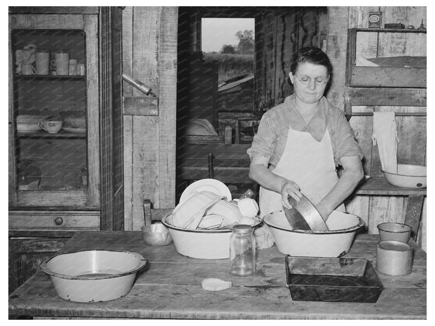 Mrs. M. LaBlanc Washing Dishes in Morganza Louisiana 1938