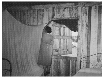 Mrs. Emil Kimball Sweeping Kitchen in Louisiana 1938