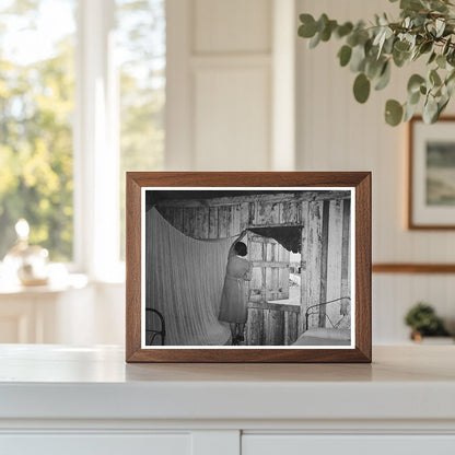 Mrs. Emil Kimball Sweeping Kitchen in Louisiana 1938