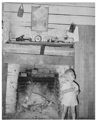 Young Boy by Fireplace in Morganza Louisiana 1938
