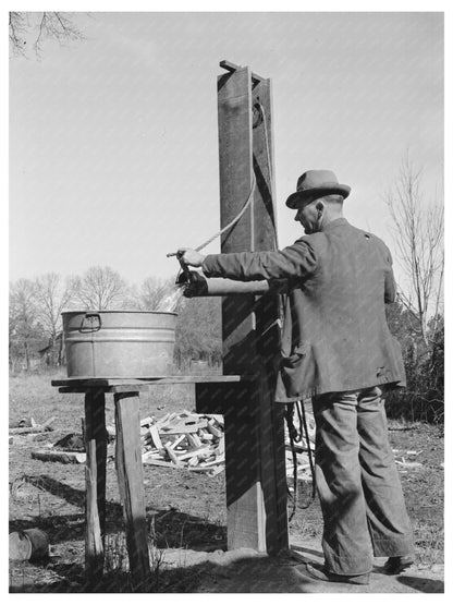 Ed Bagget Drawing Water at Well Laurel Mississippi 1939