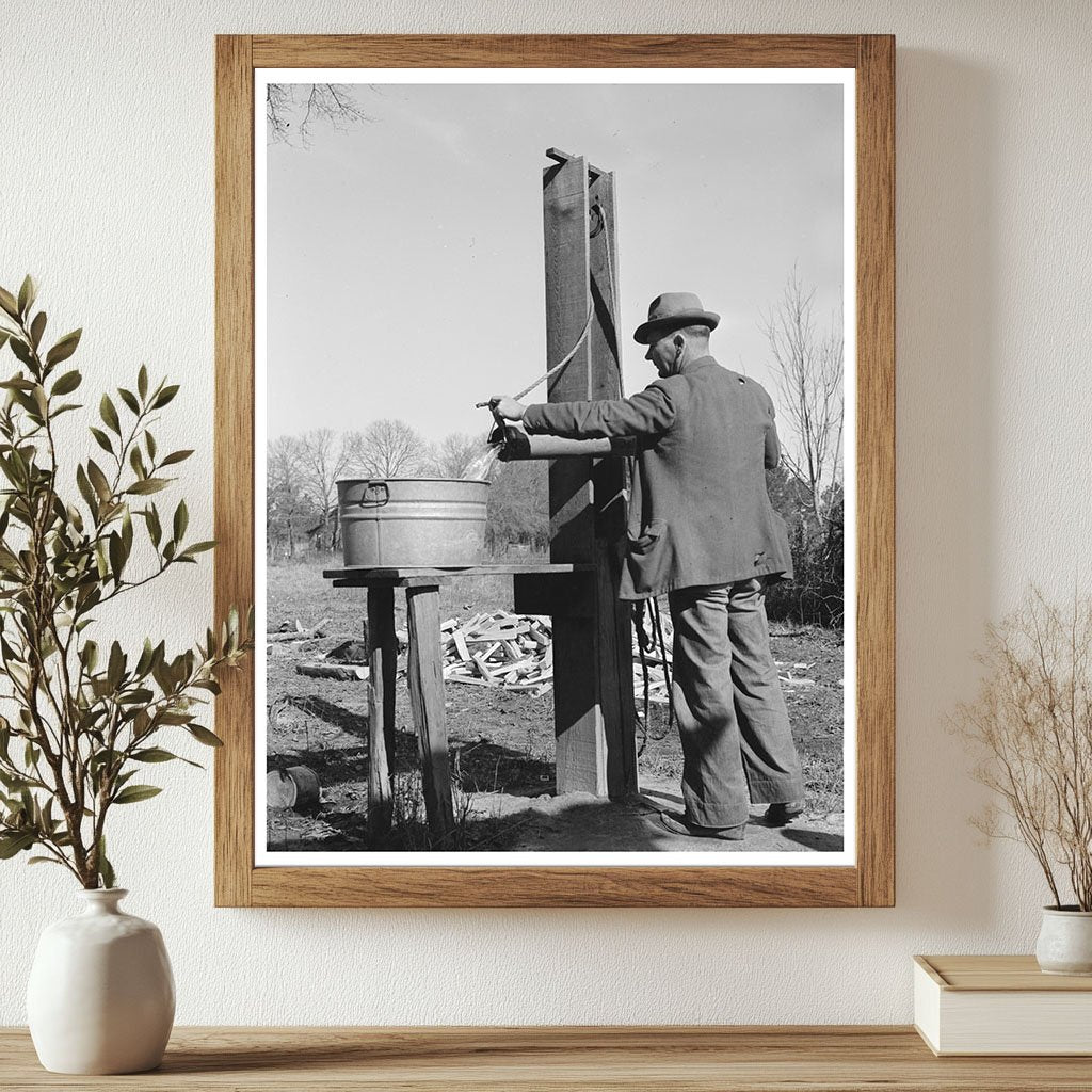 Ed Bagget Drawing Water at Well Laurel Mississippi 1939