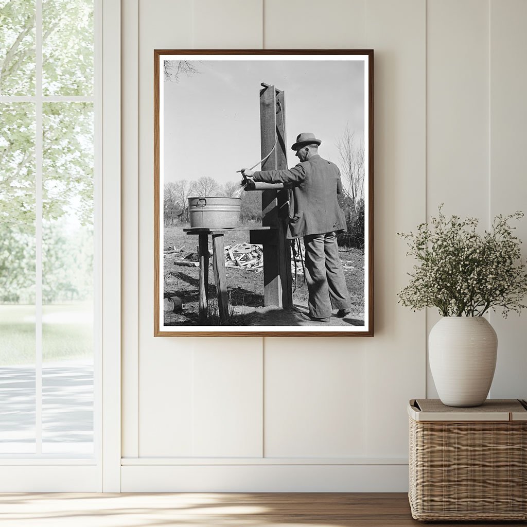 Ed Bagget Drawing Water at Well Laurel Mississippi 1939